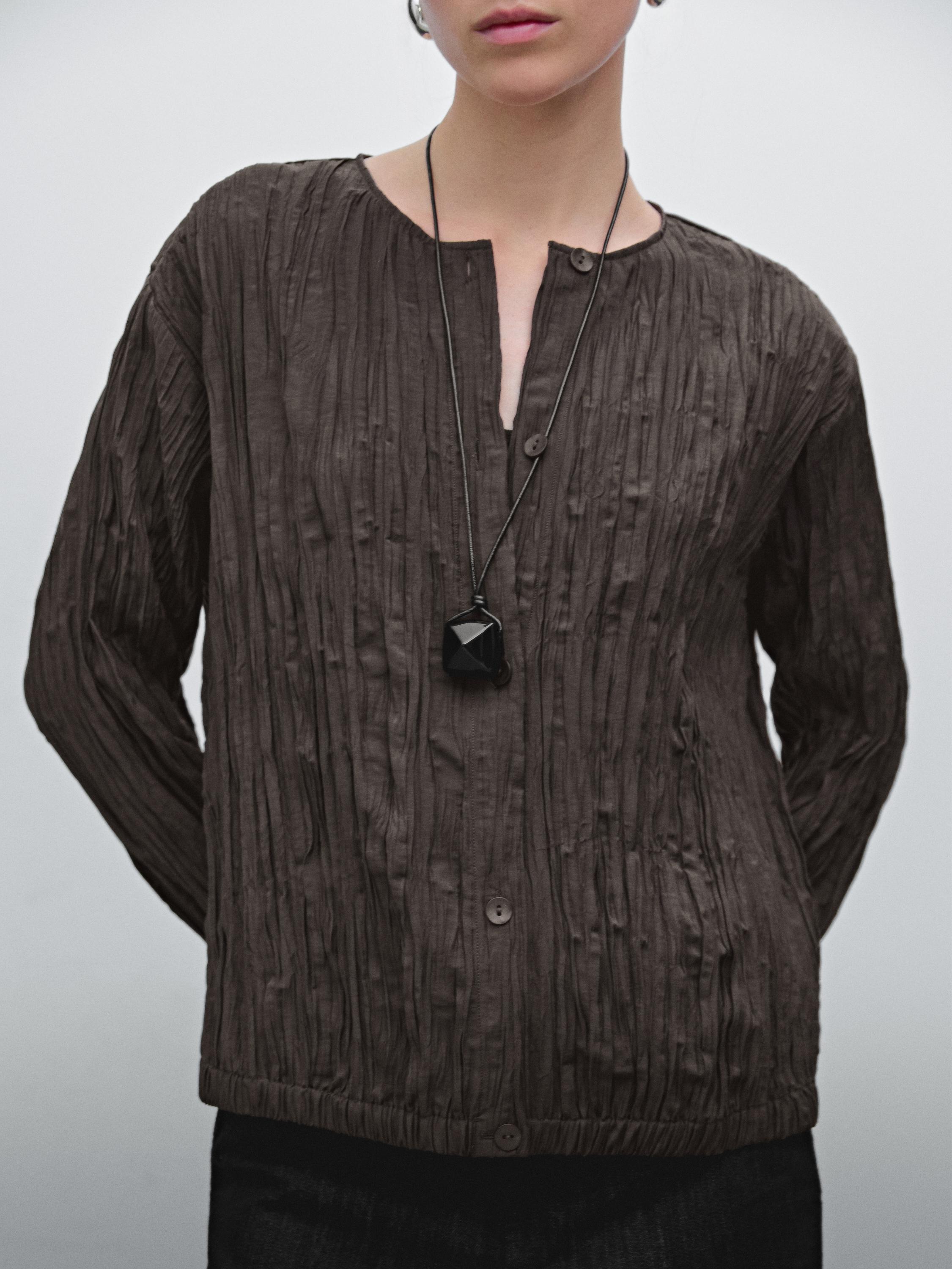 Flowing pleated bomber-style shirt