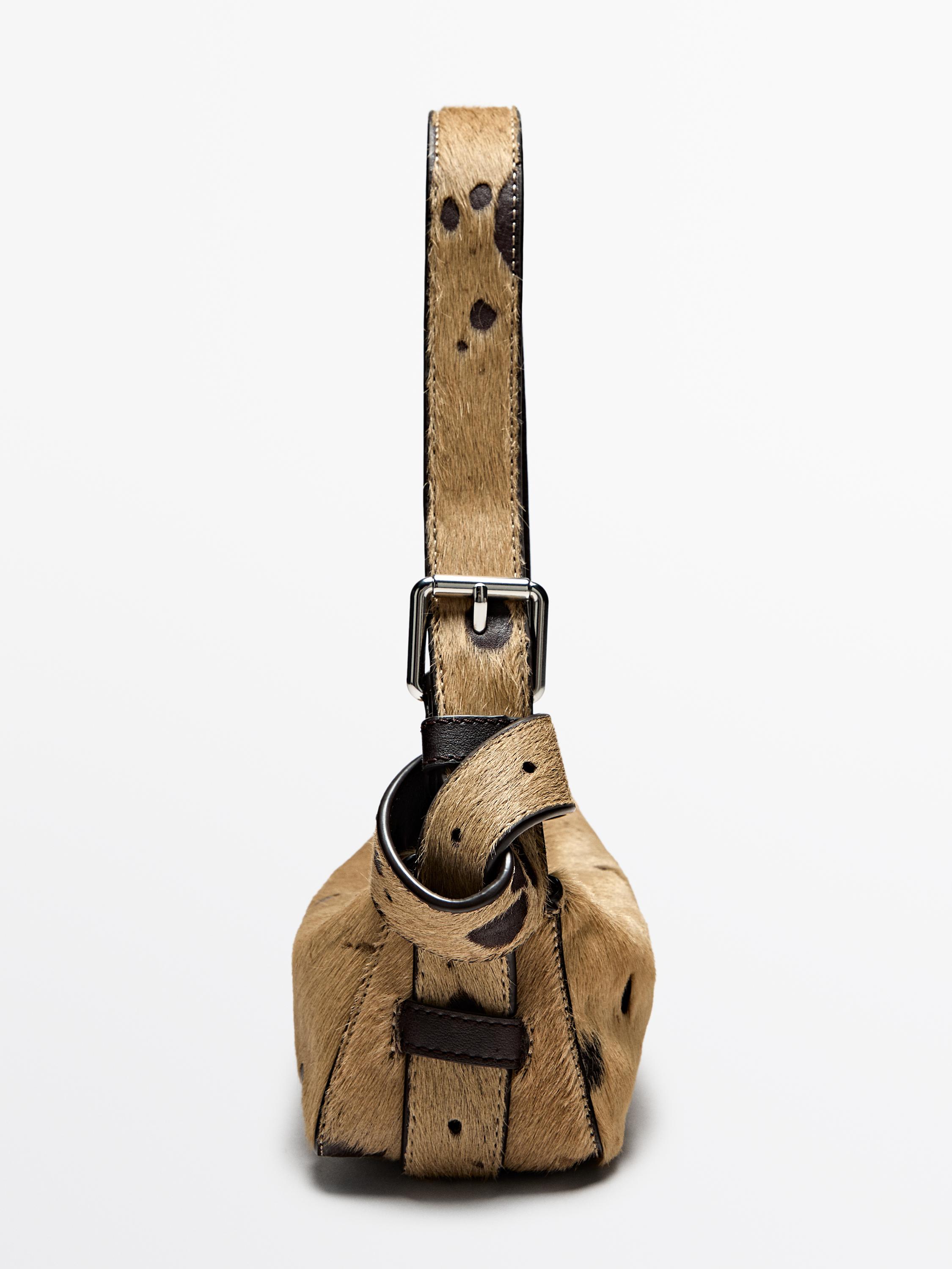 Printed mini hair on leather bag