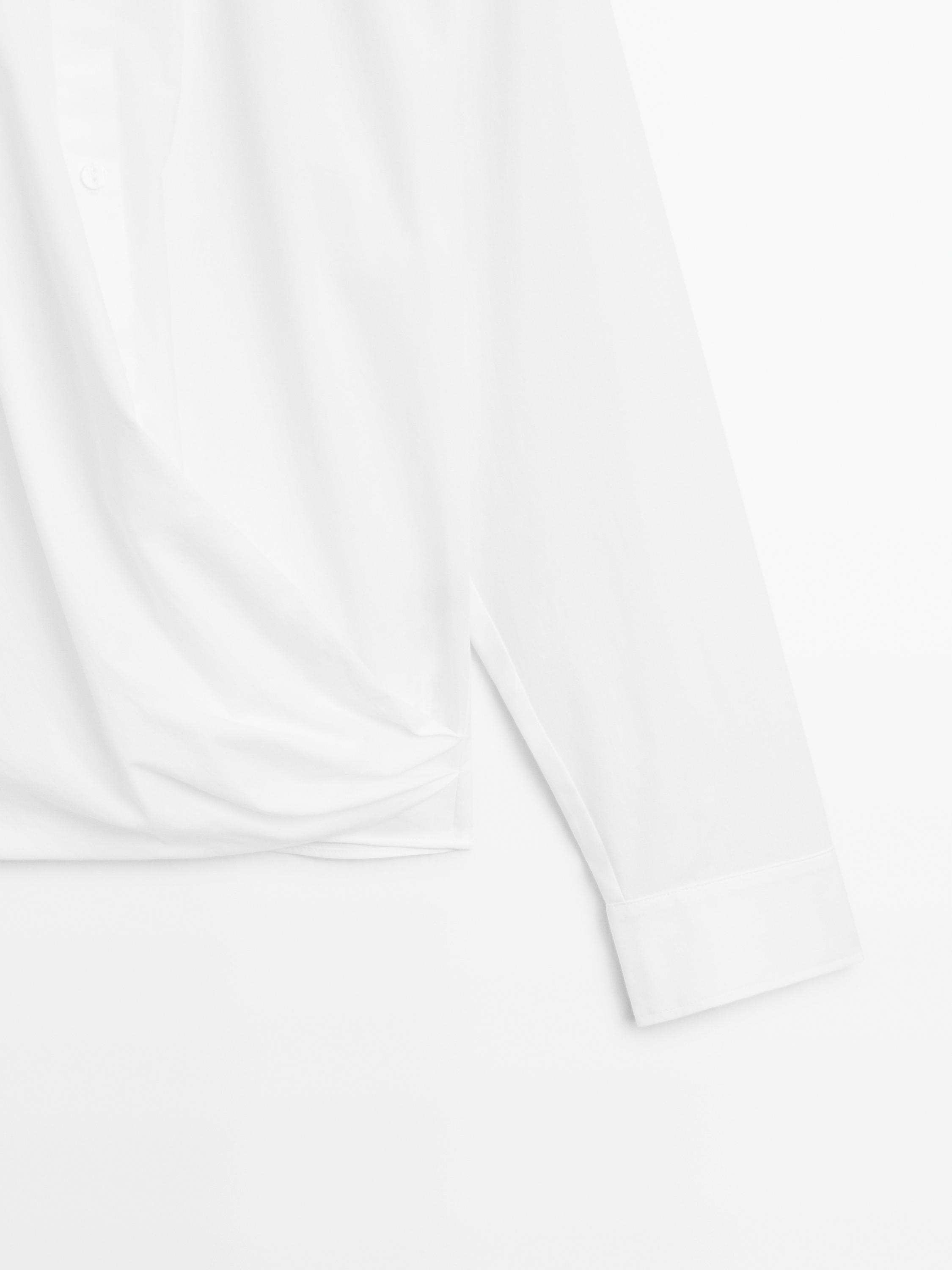 100% cotton shirt with draped asymmetric hem