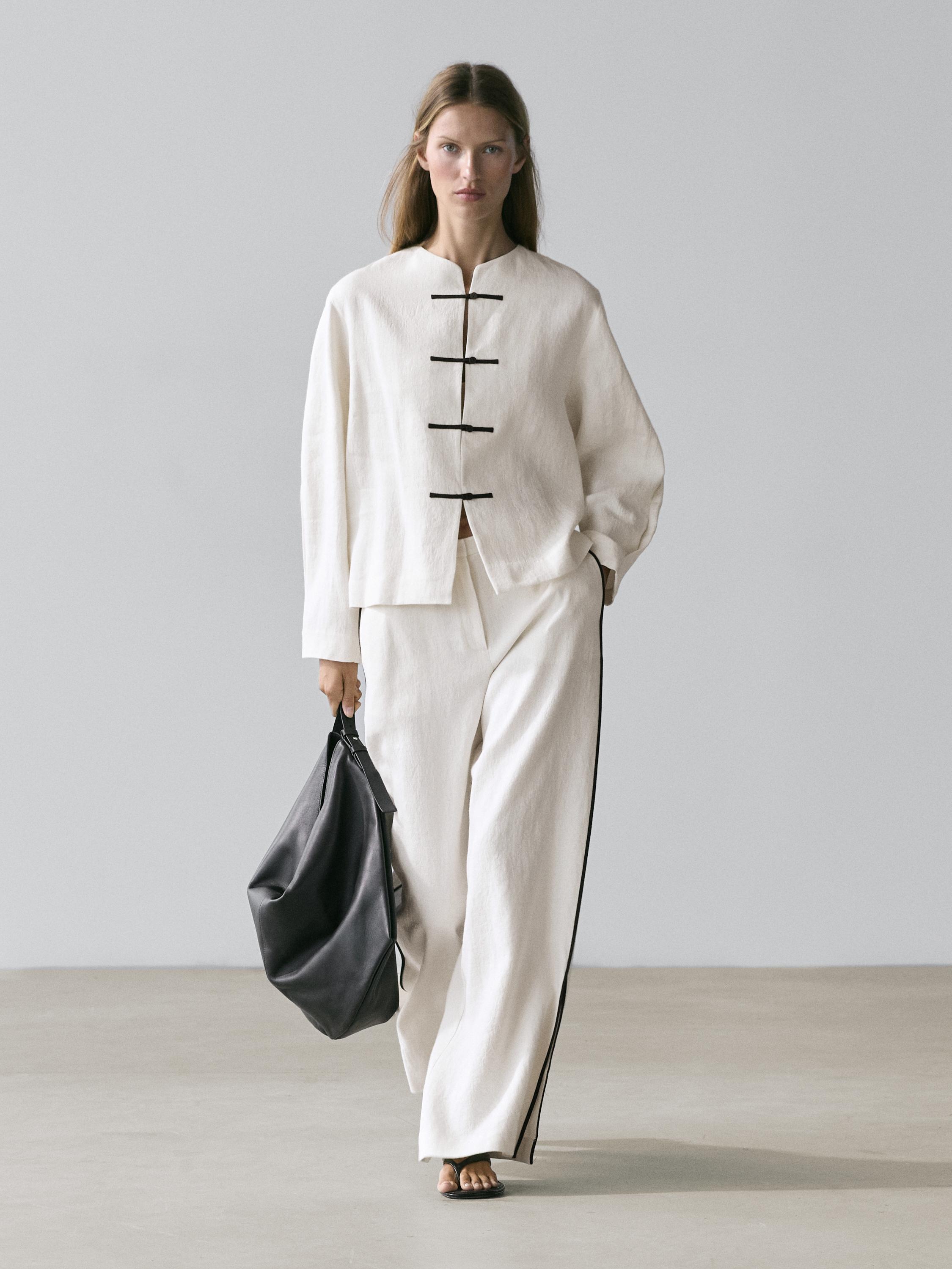 Linen trousers with contrast piping
