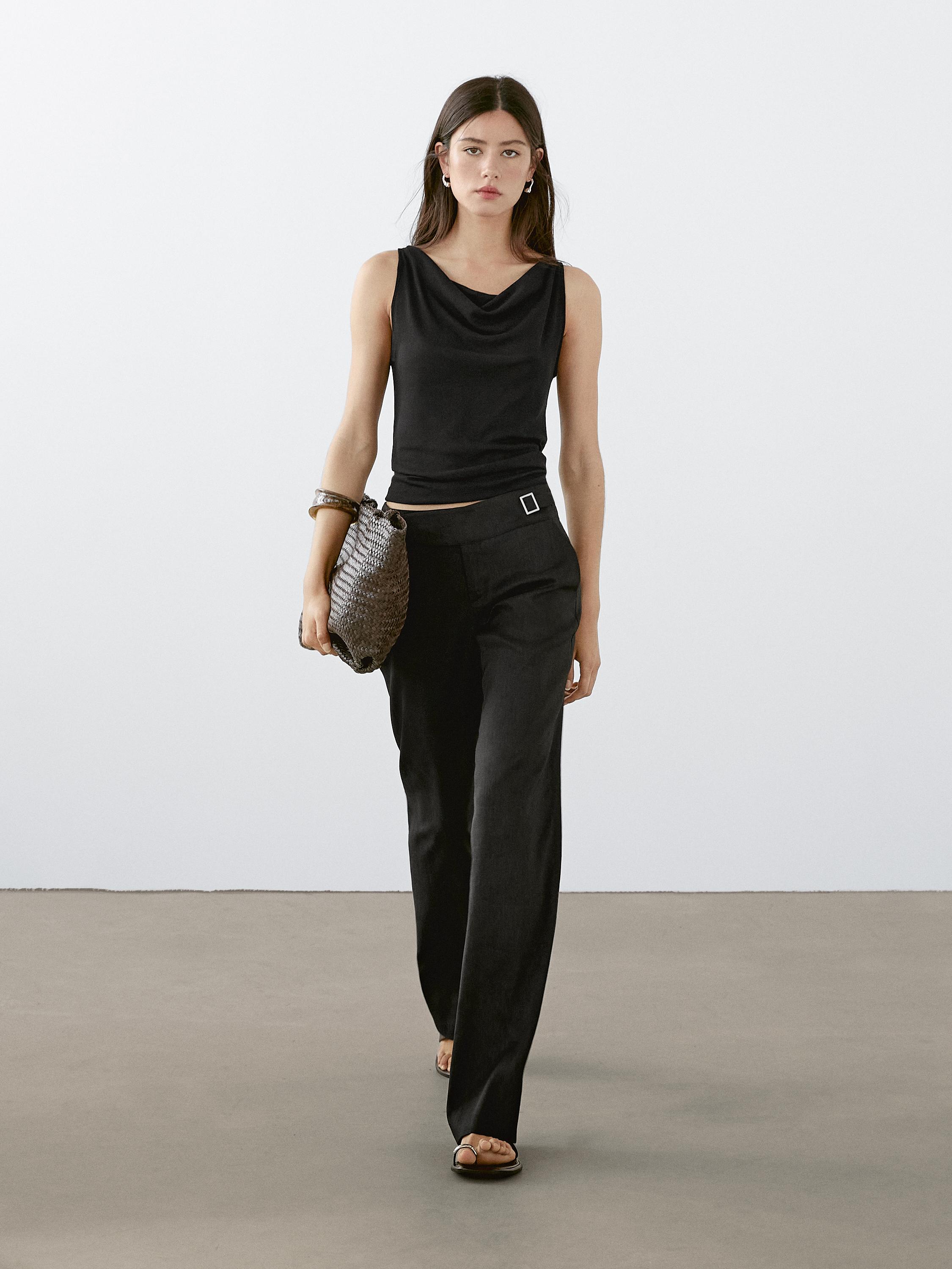 Sleeveless top with draped neckline