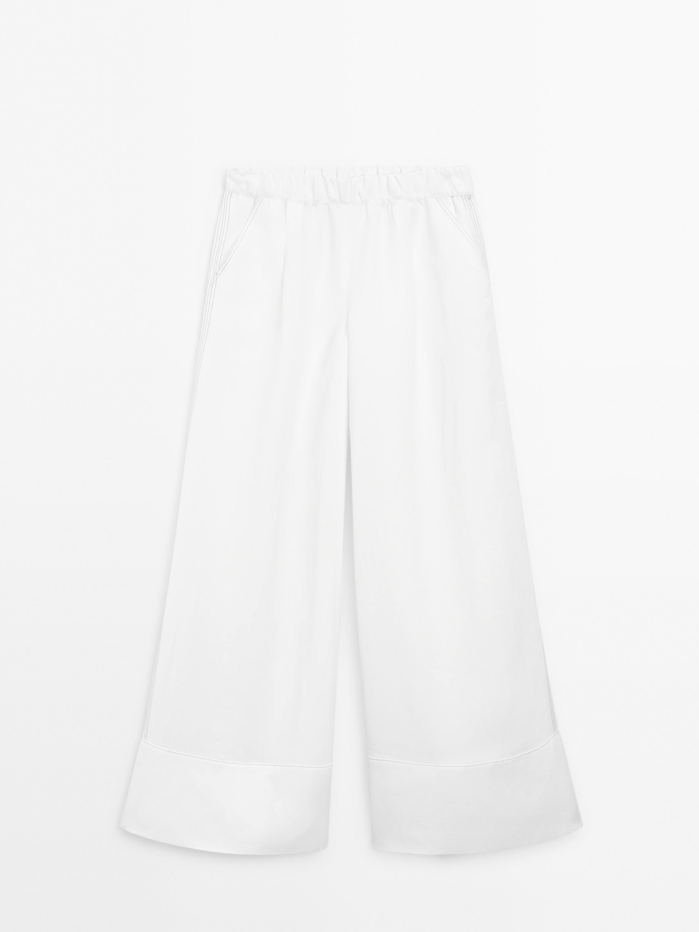Pantaloni largi cu tighel contrastant