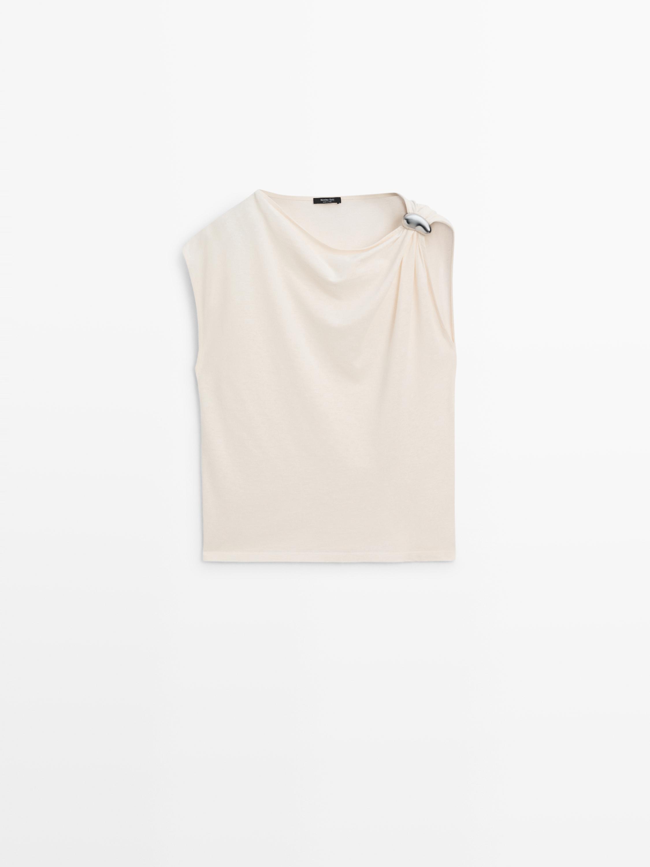 Asymmetric top with shoulder appliqué