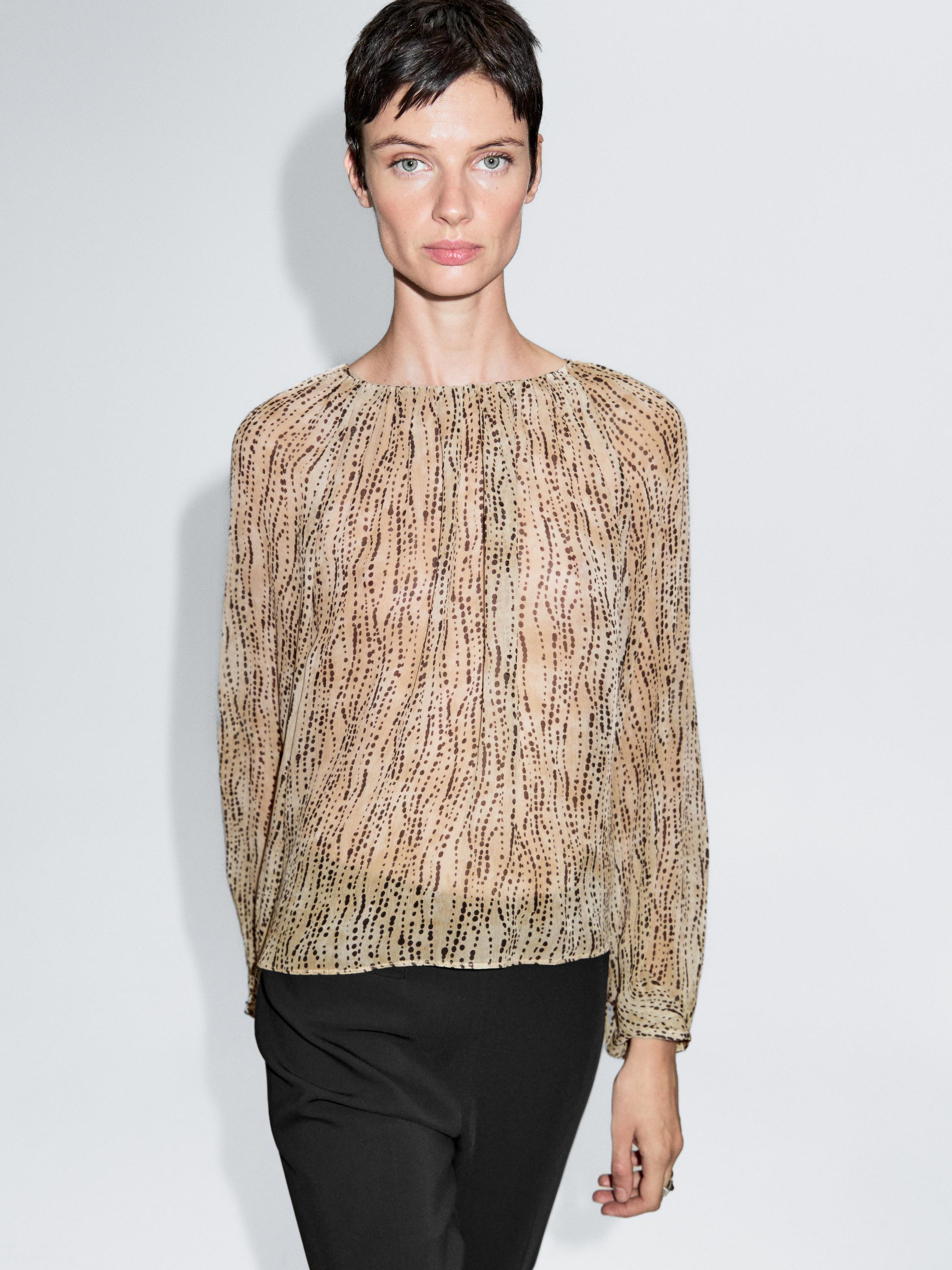 Semi-sheer draped blouse