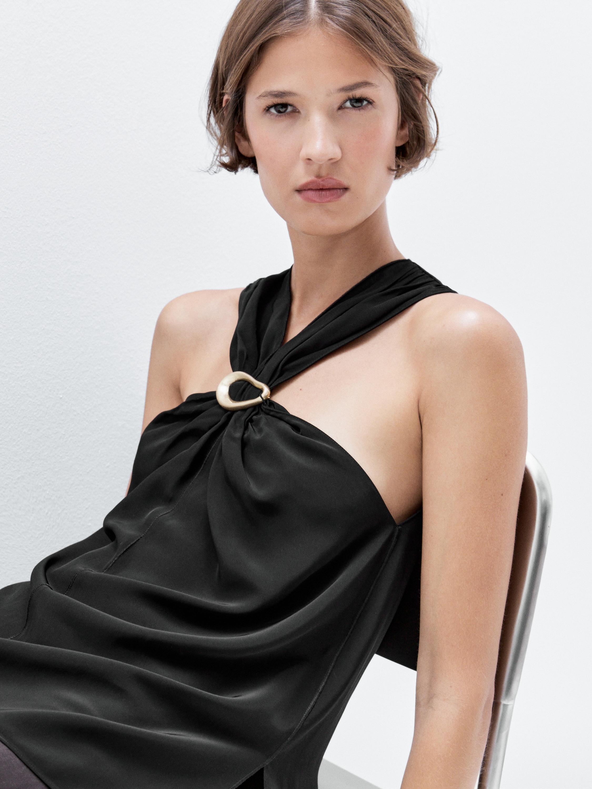 Halterio viršus su nusegama brošiūra