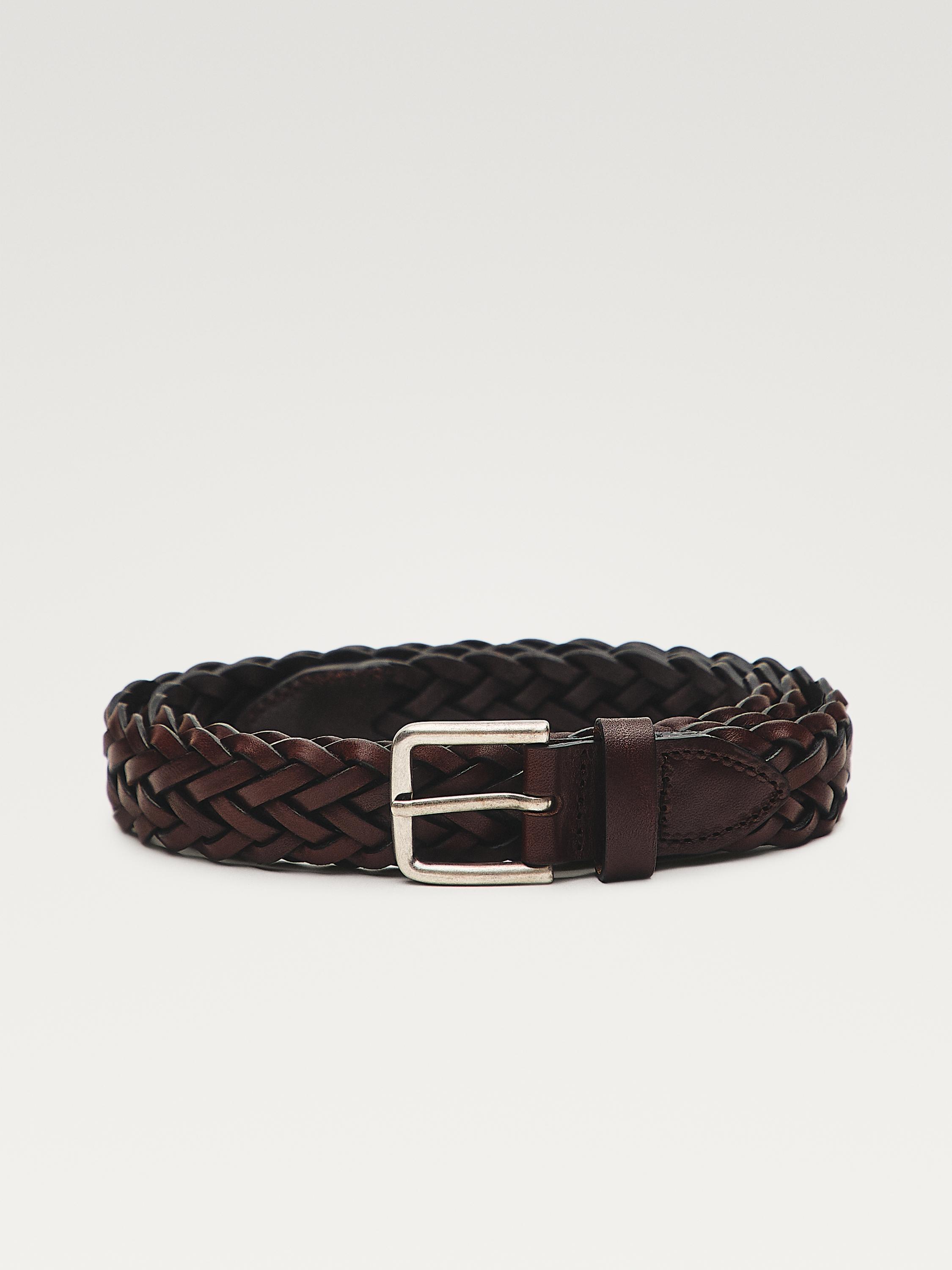 Front view of a brown braided belt with a silver metal buckle.