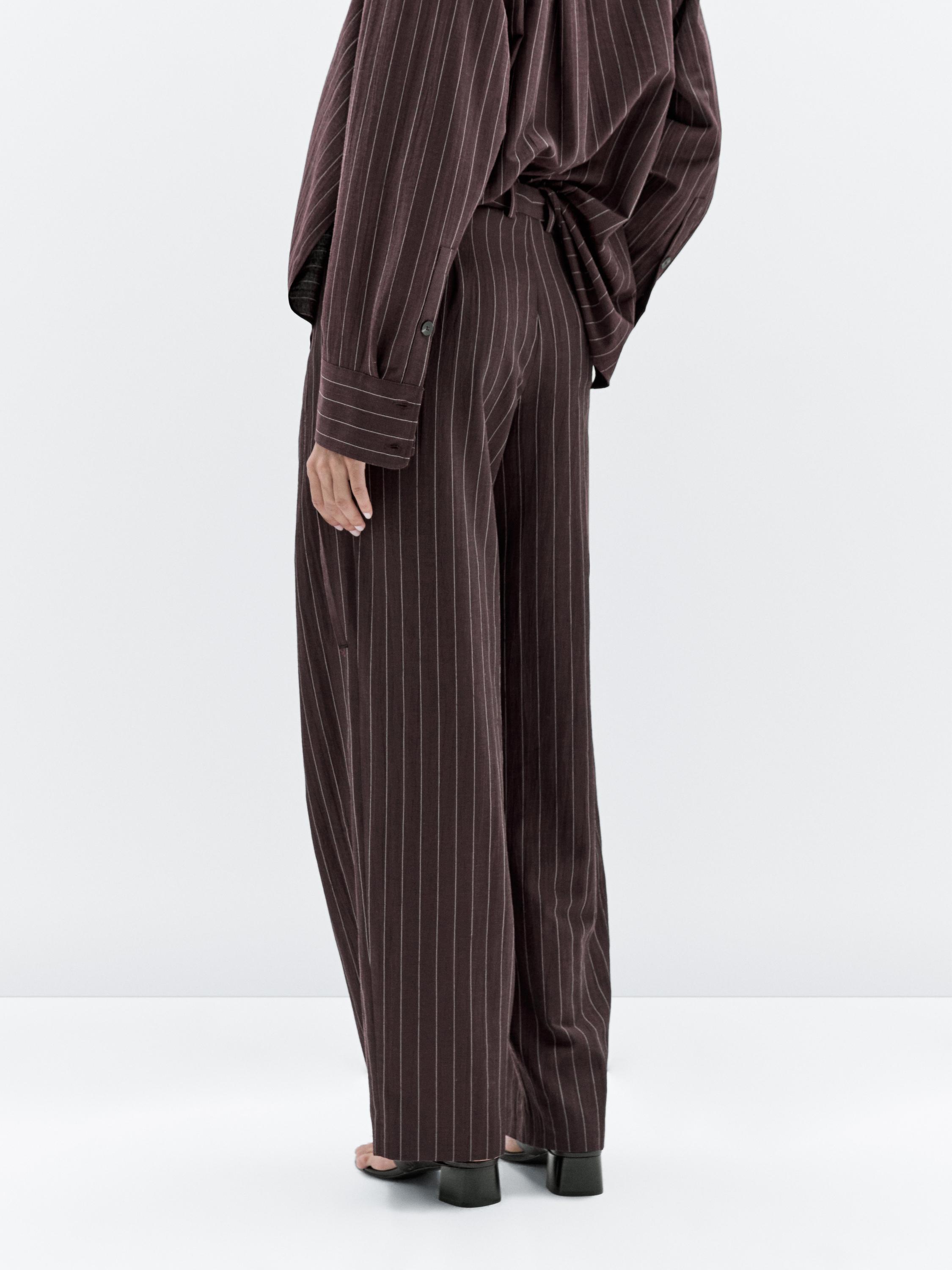 Darted pinstripe trousers