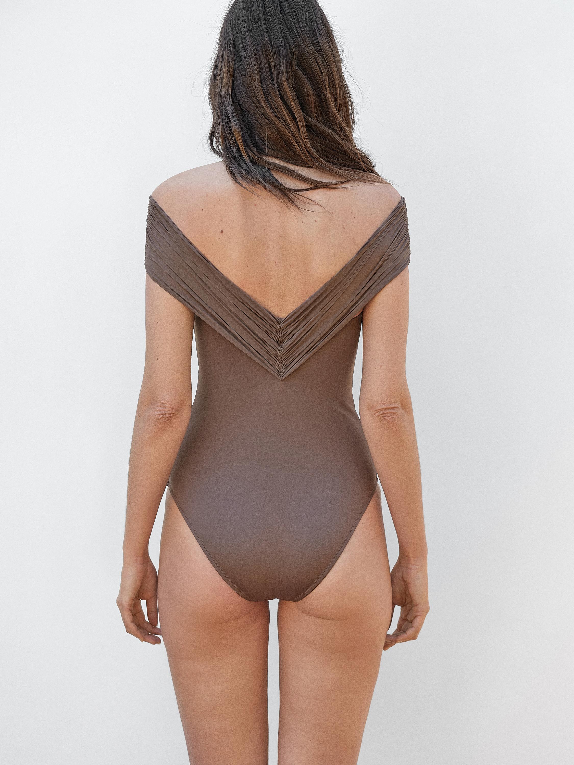 Bandeau swimsuit with criss-cross straps