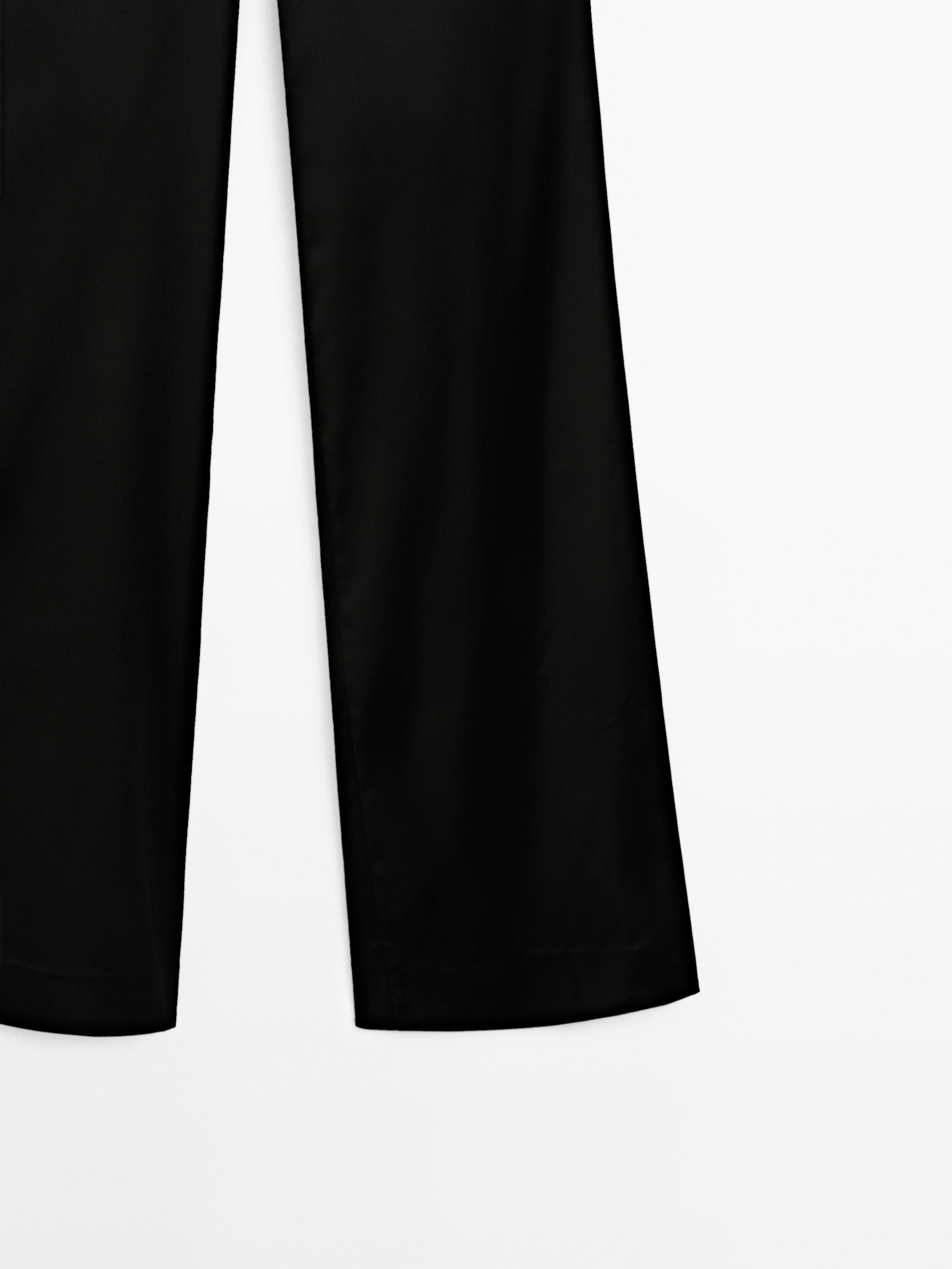Pantalón flare satinado aberturas