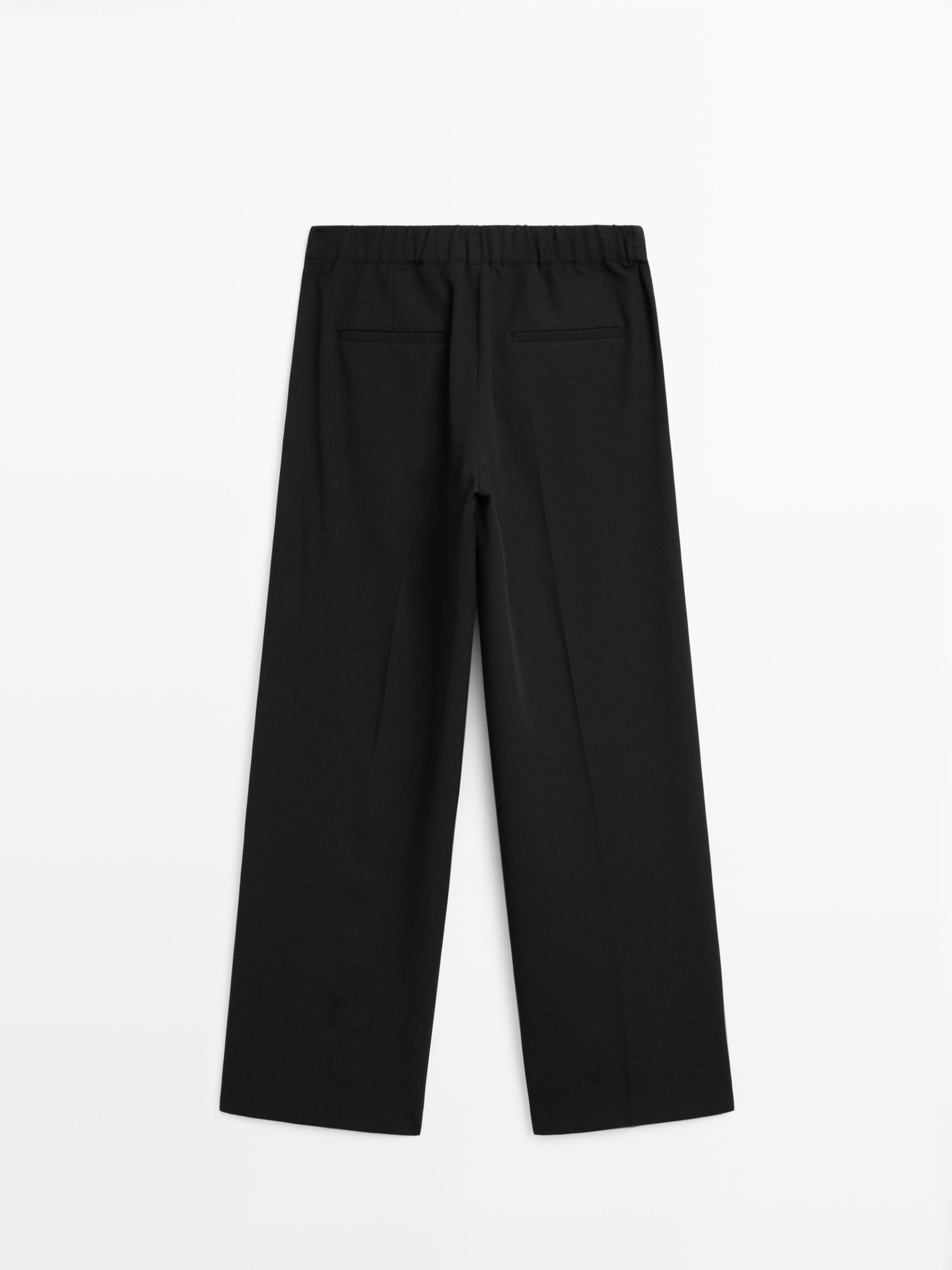 Wide-leg flowing trousers with darts