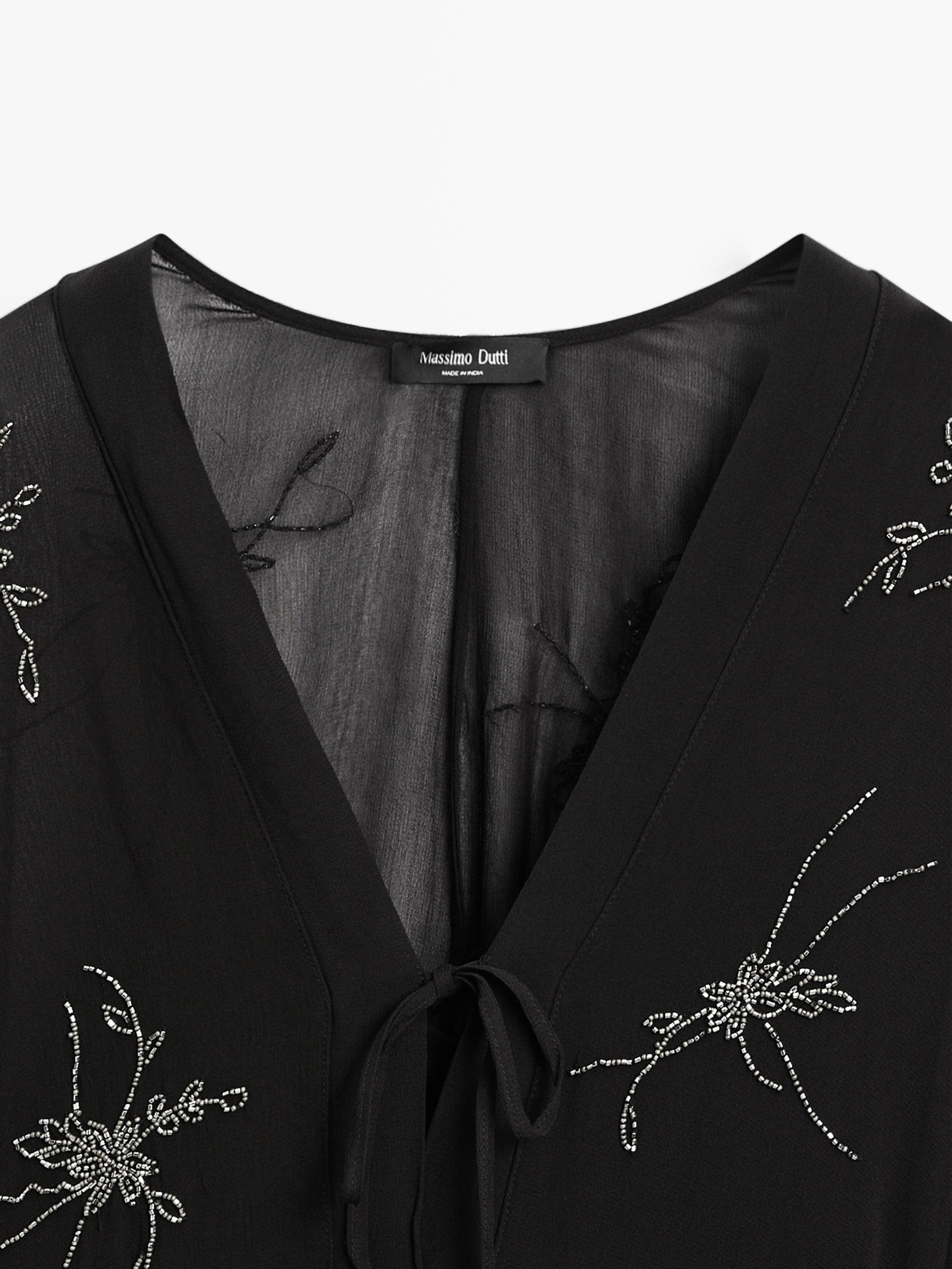 Flowing midi dress with embroidery