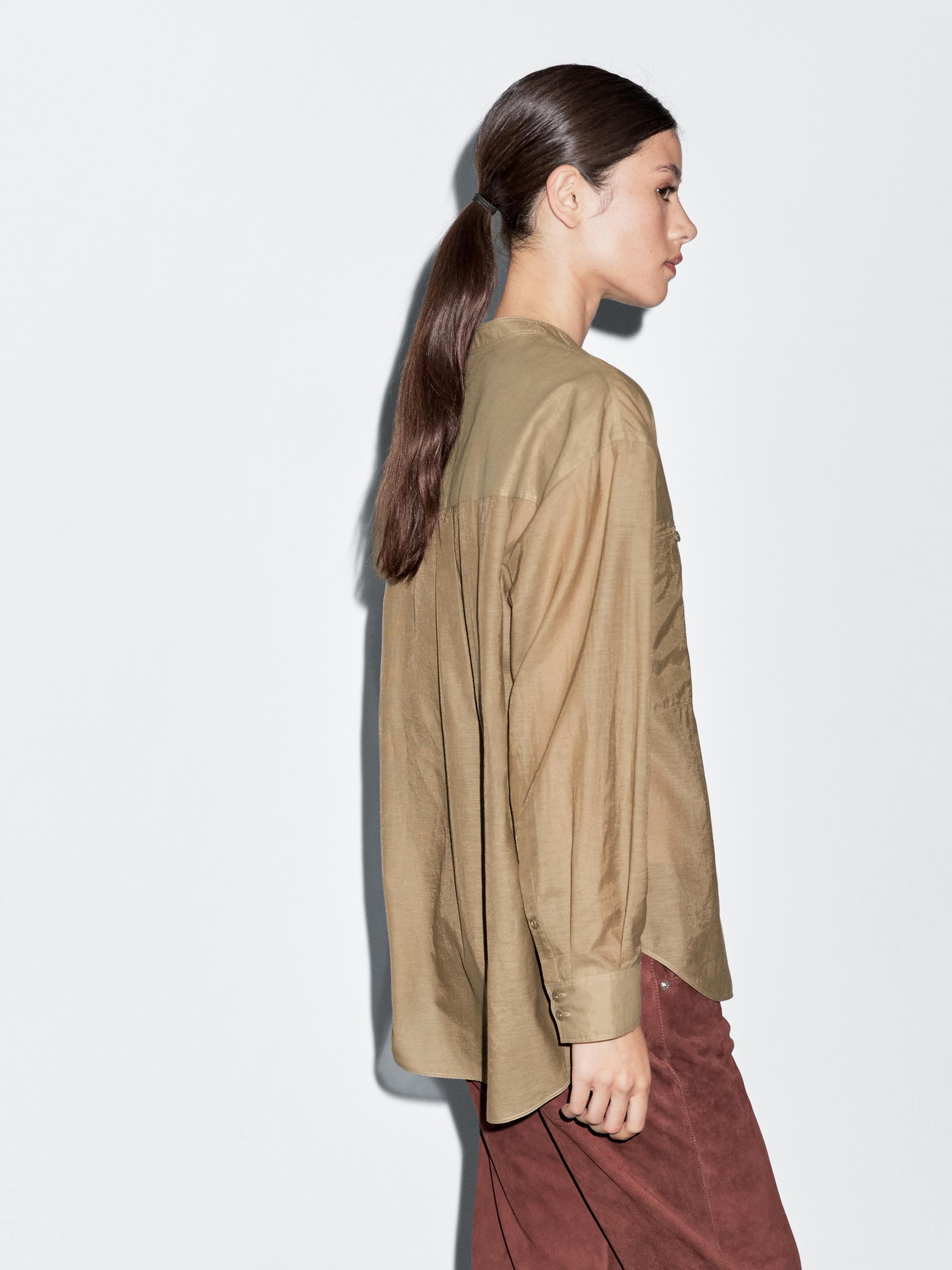 Long shirt with stand collar
