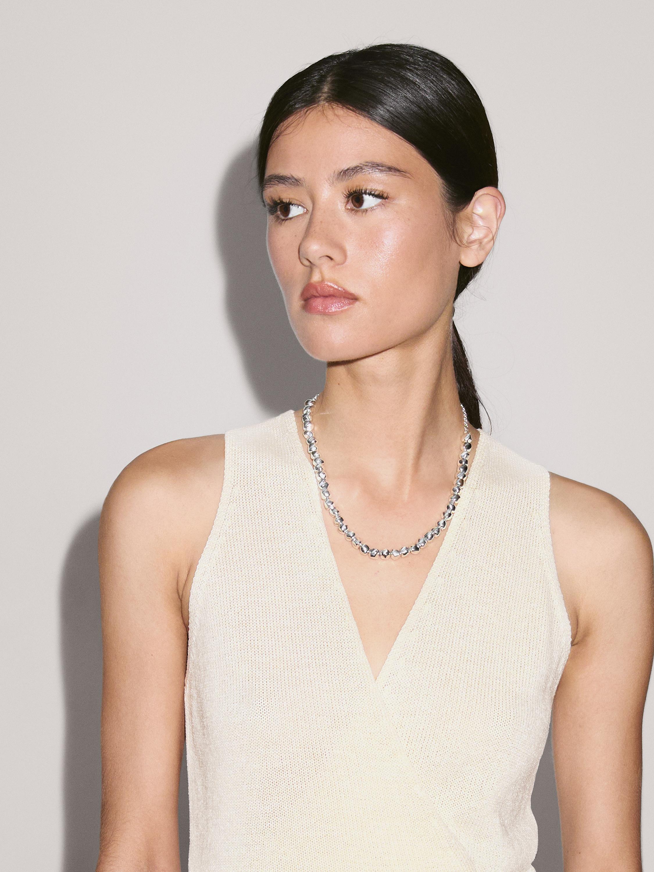 Knit crossover waistcoat with drawstring