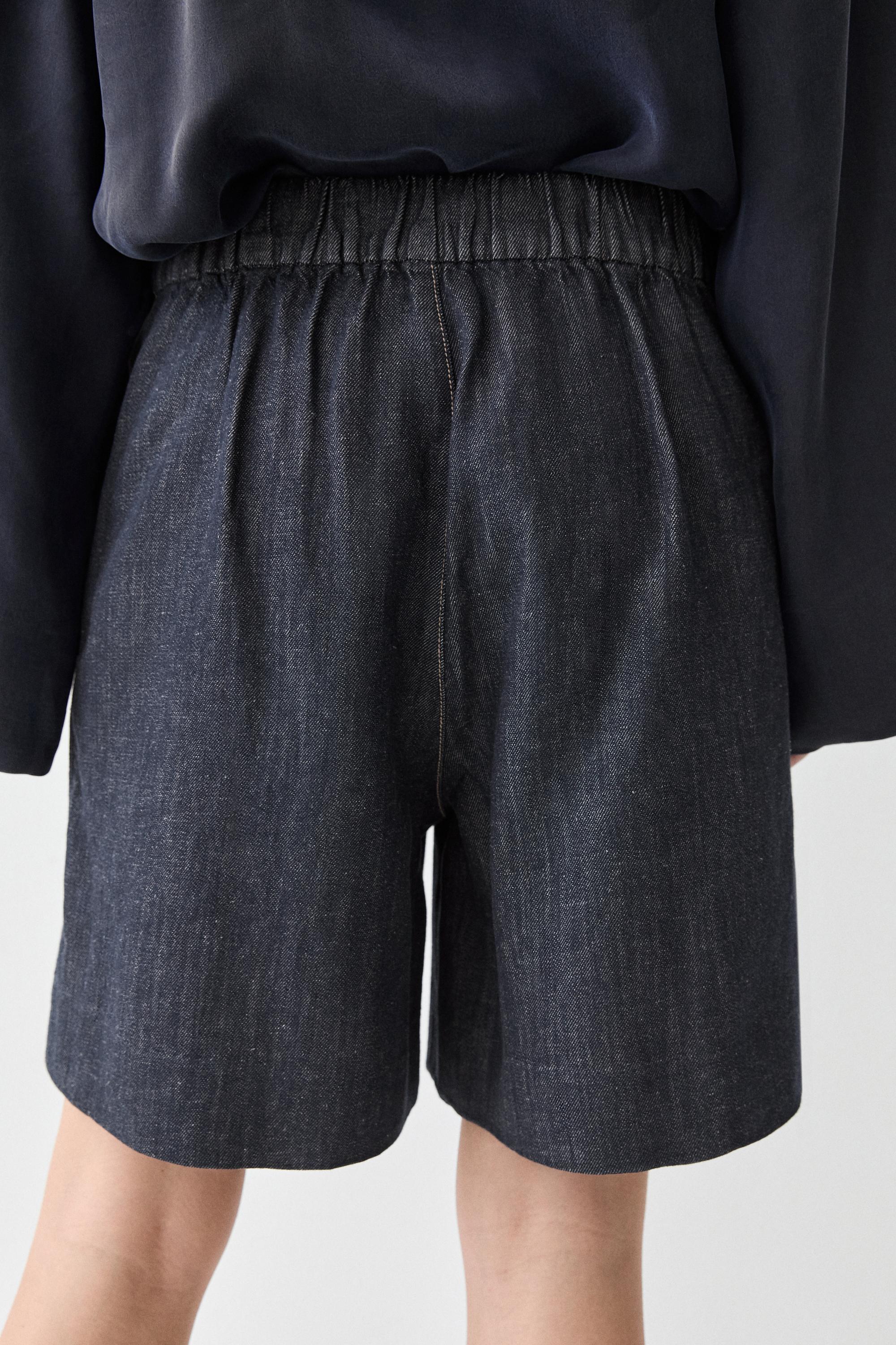 Cotton denim Bermuda shorts with topstitching — DARK BLUE