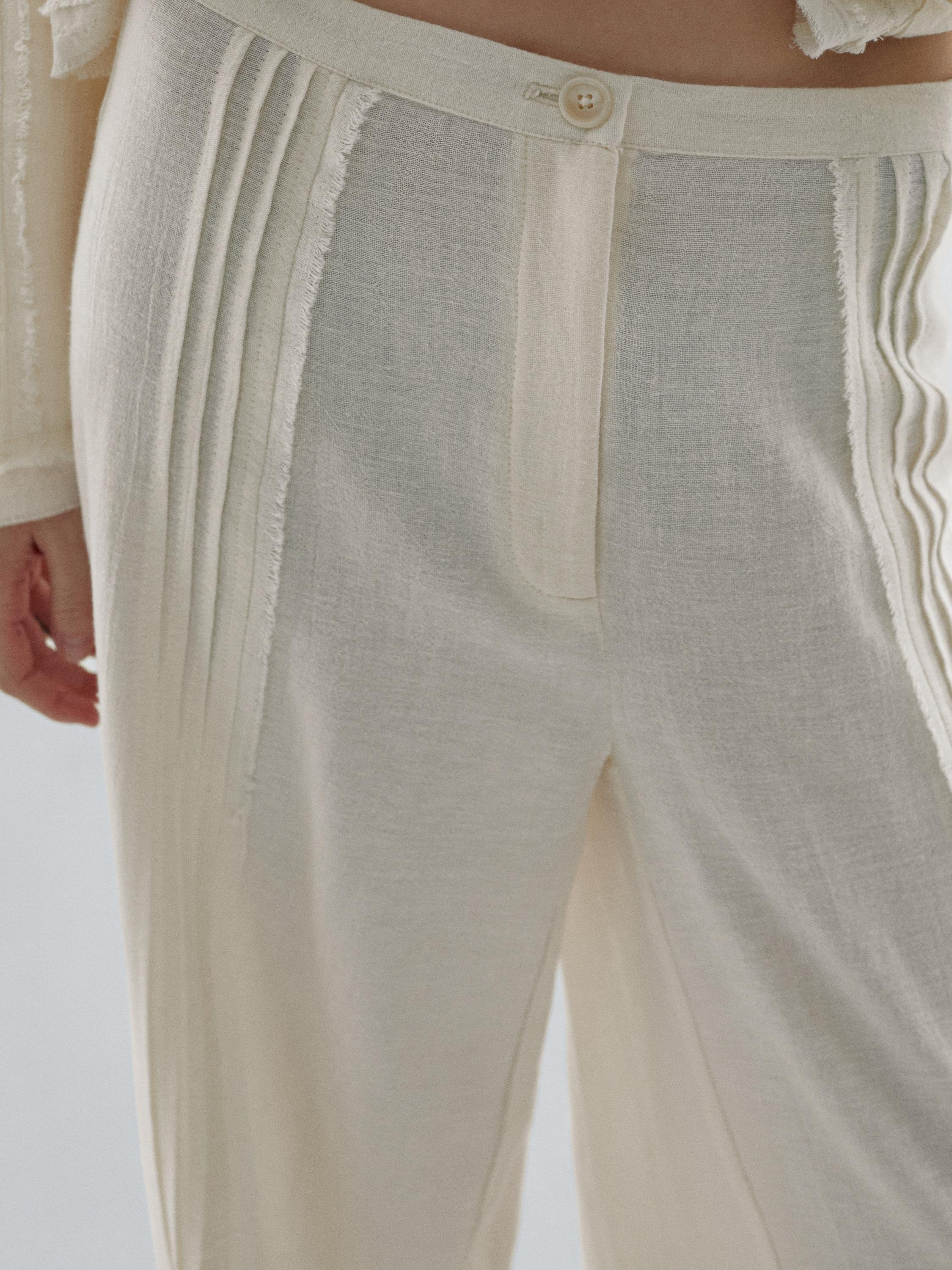 Pantalon avec broderies en coton mélangé