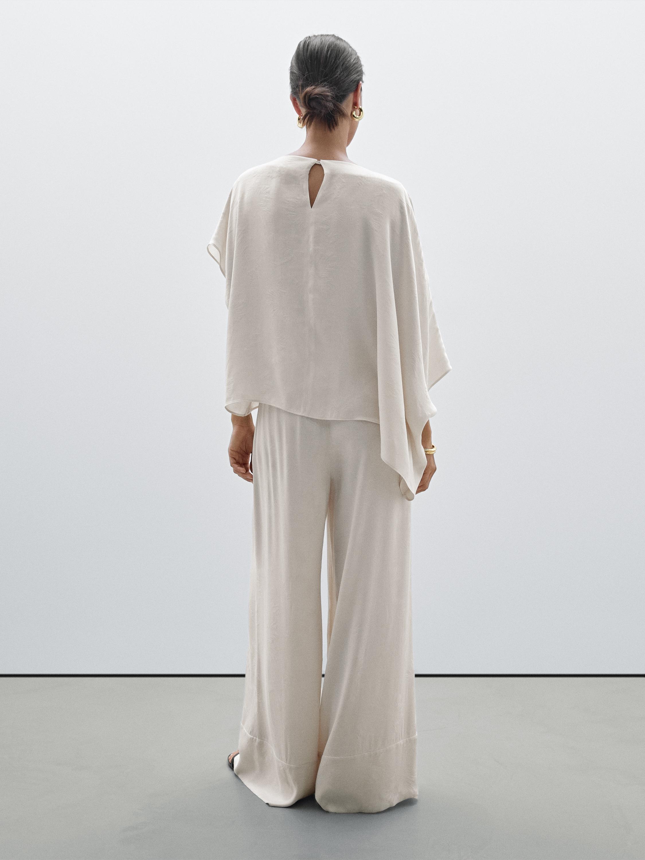 Printed fabric trousers with hem detail