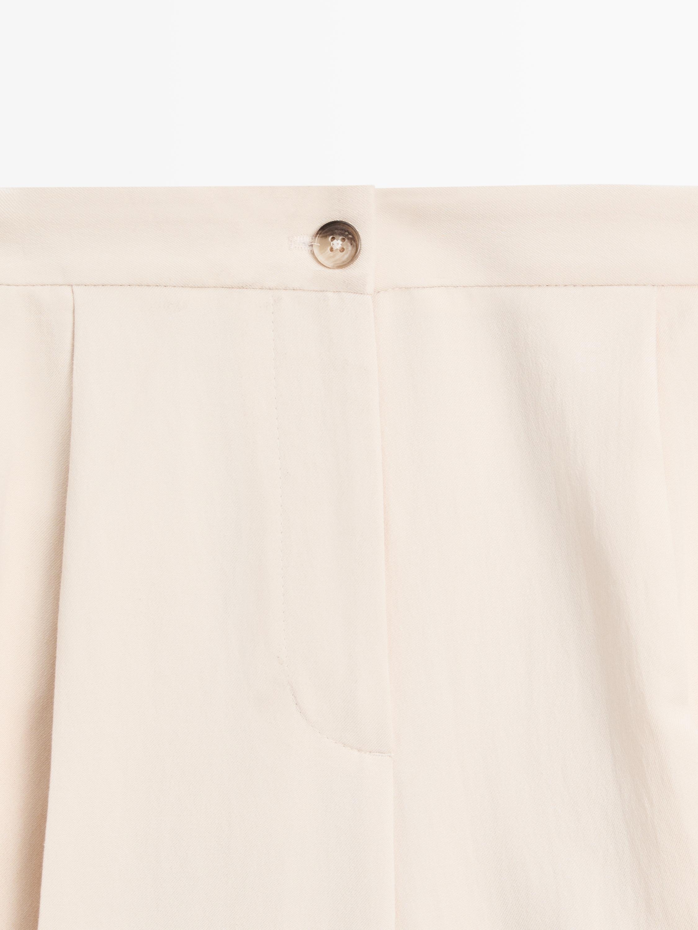 Flowing trousers with turn-up hems — CREAM