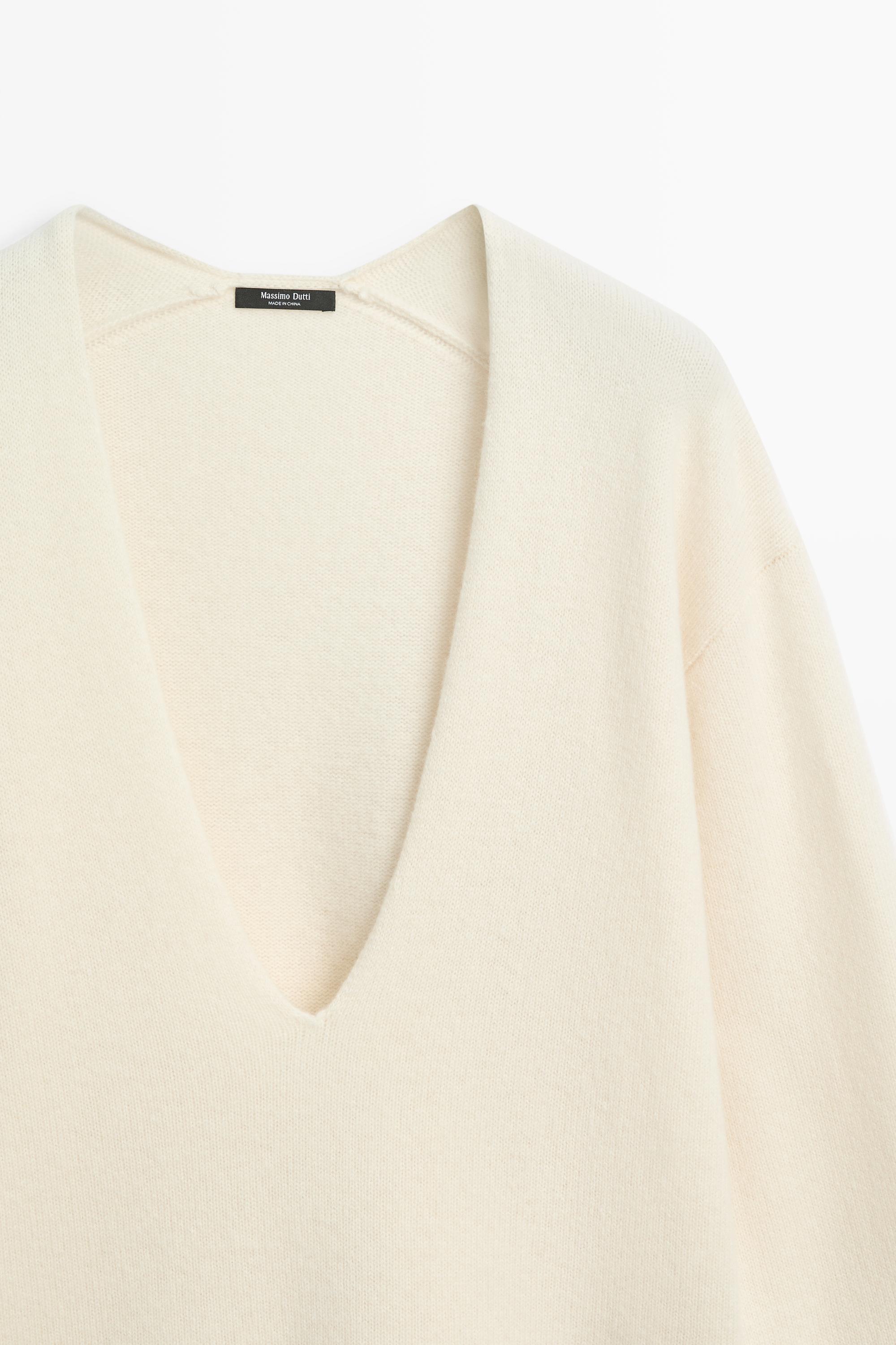 Long-line knit sweater with neckline detail — OCHRE MARL