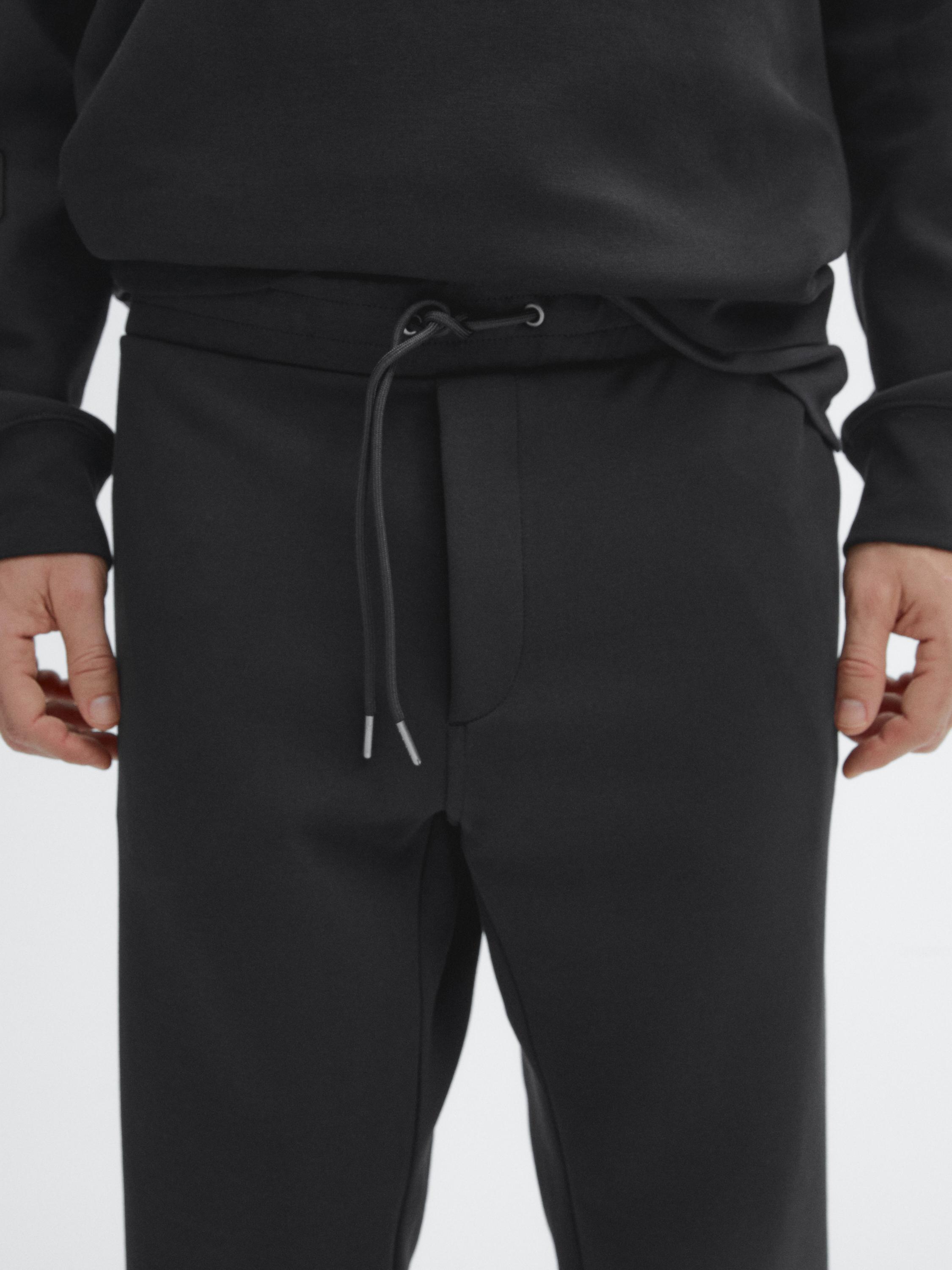 Trousers with side pocket detail