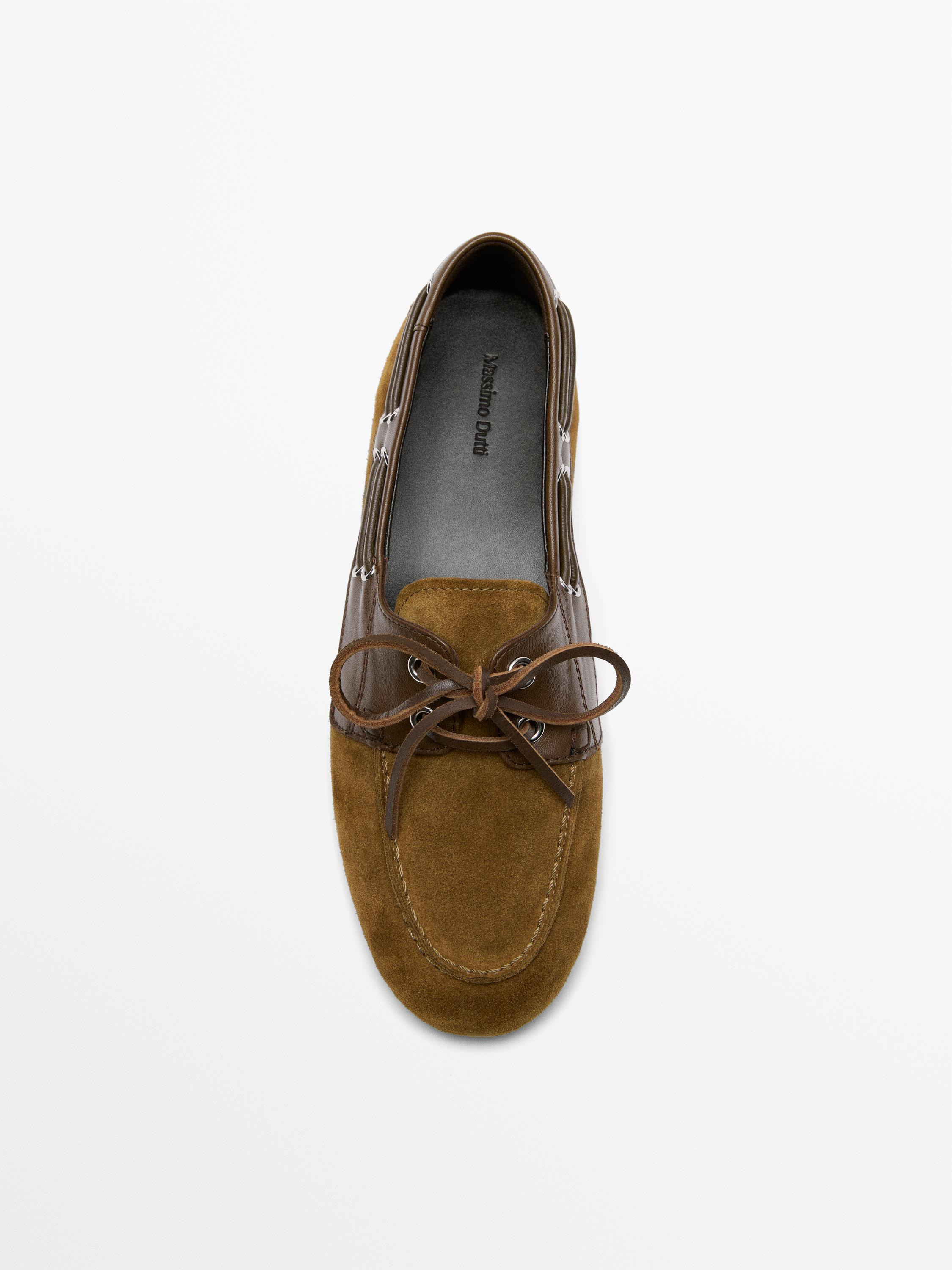 აქლემისფერი ნავის ფეხსაცმელი თასმებითა და ხილული ნაკერებით, ზედა ხედი. შიდა ტექსტი: "Massimo Dutti".