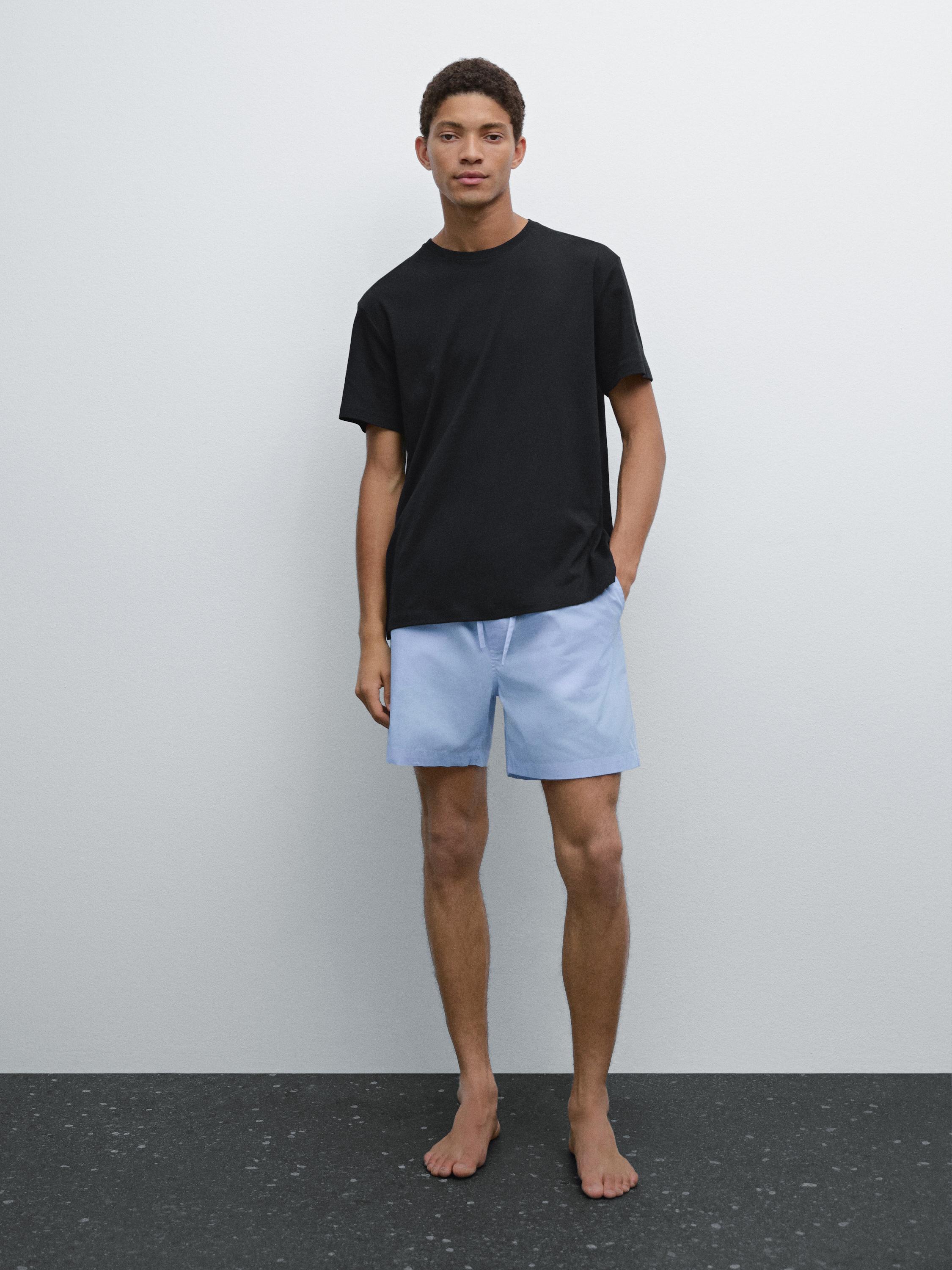 Short sleeve pyjama top and striped trousers