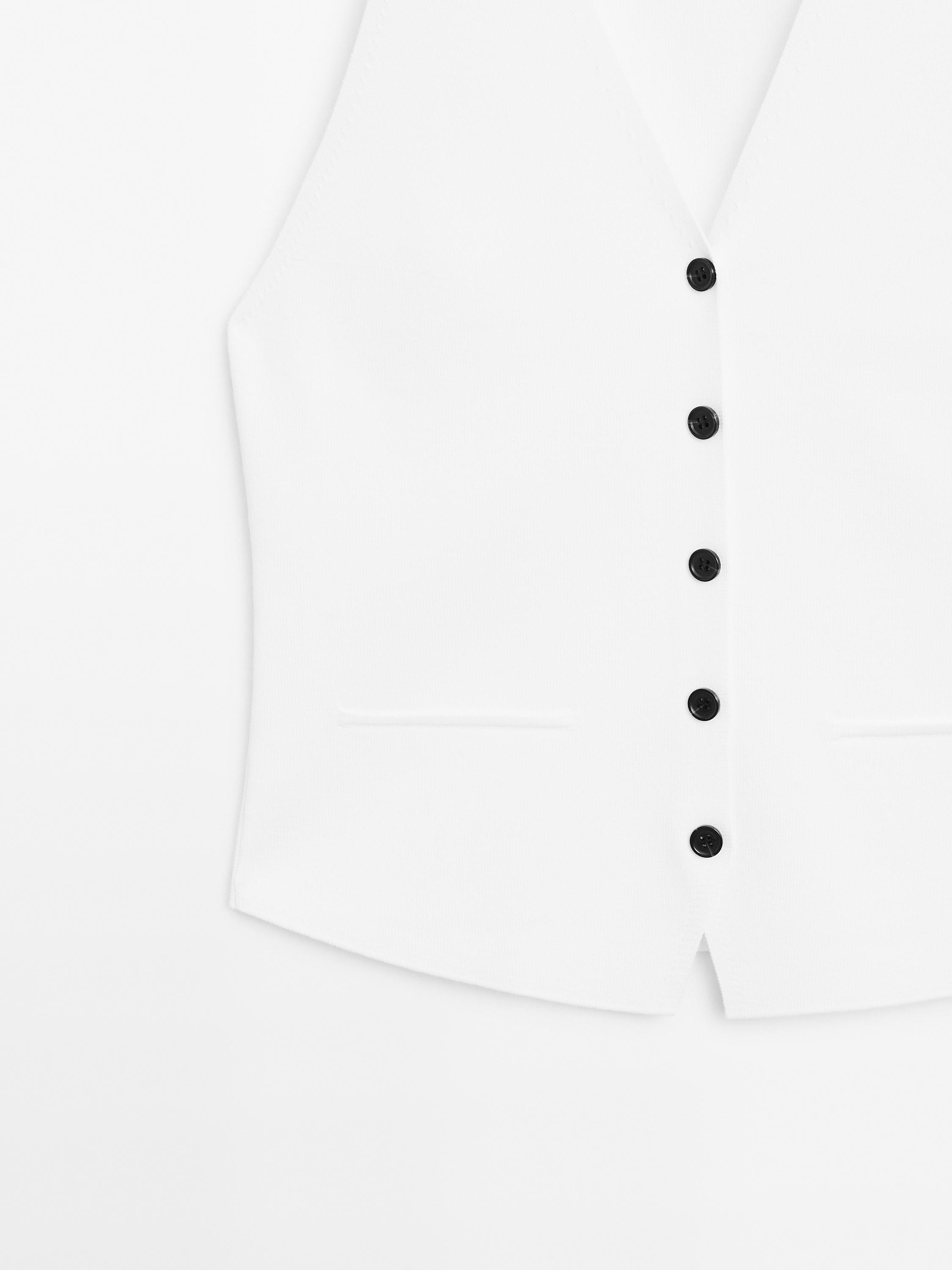 Knit waistcoat with contrast buttons