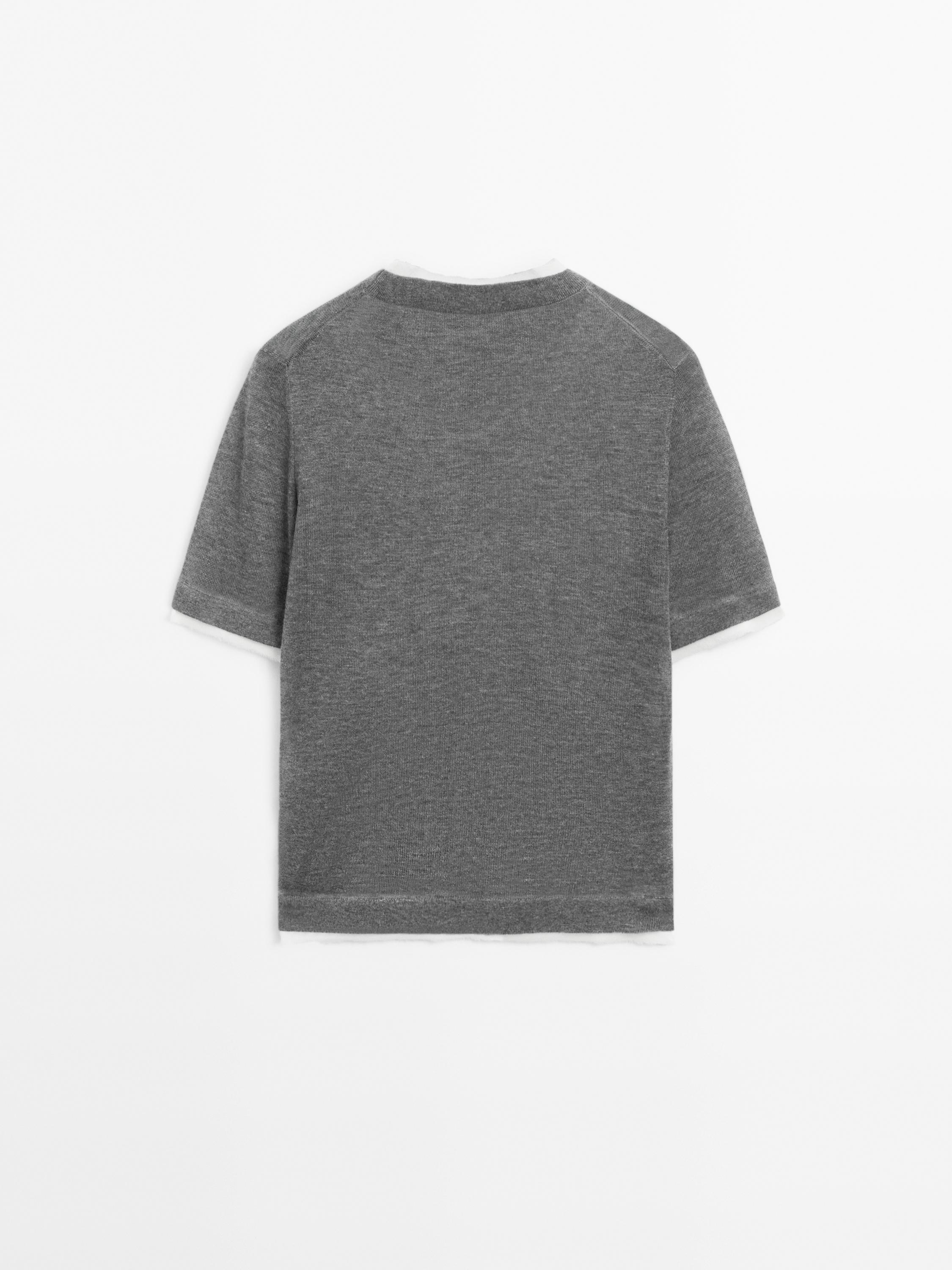 Knit sweater with short sleeves and distressed detail