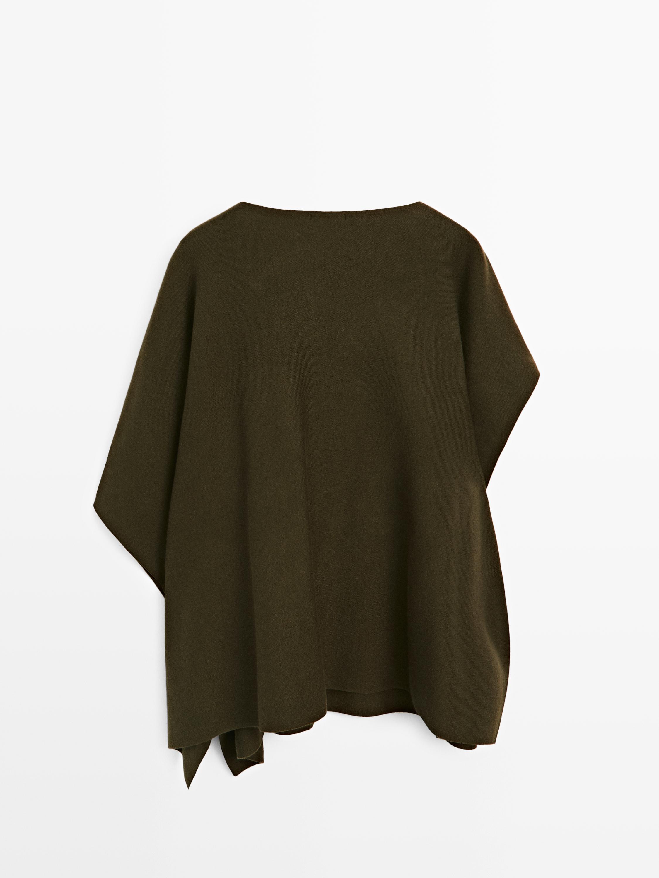 Knit cape with brooch detail