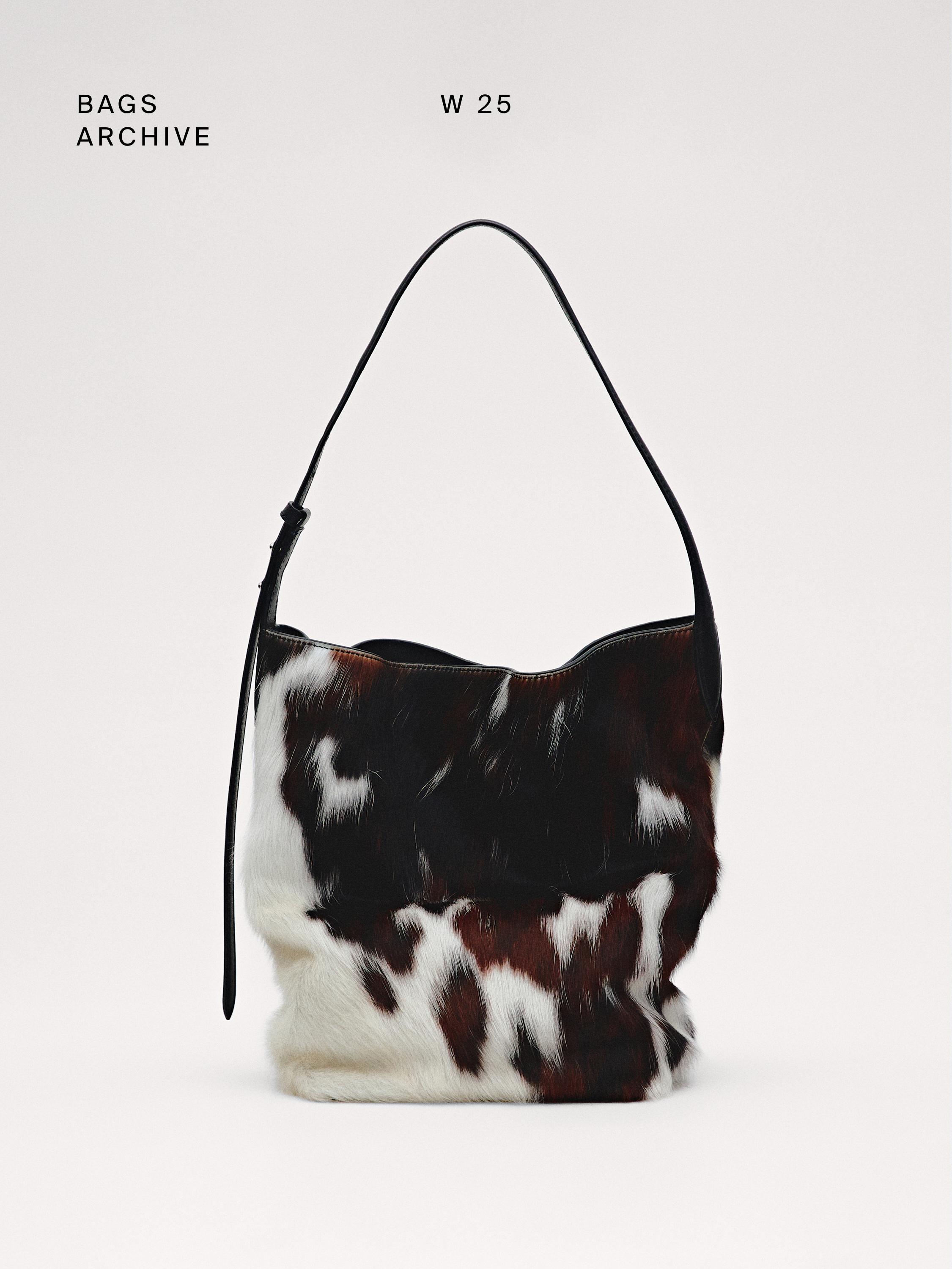 Beuteltasche aus Leder und Kunstfell mit Animalprint