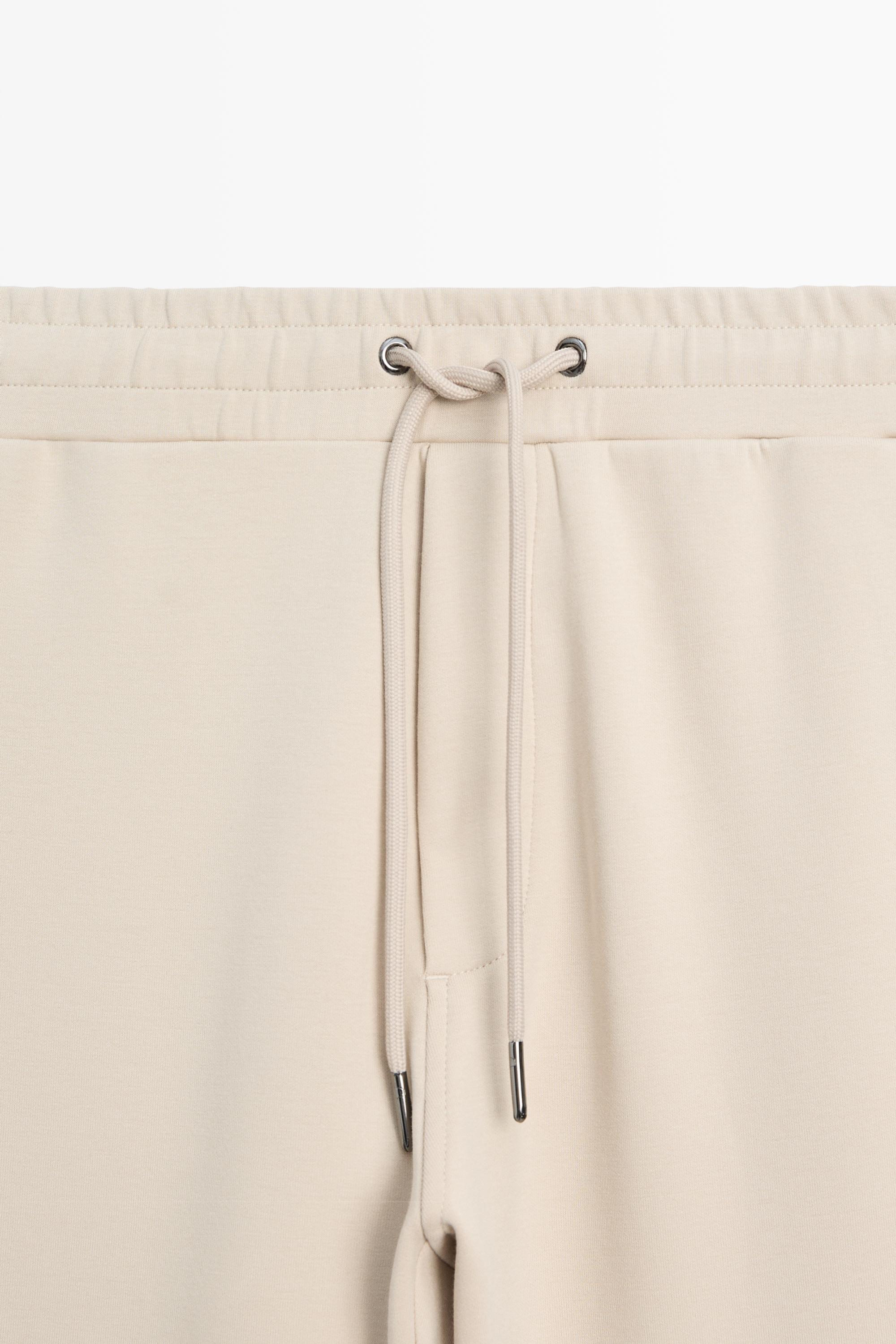 Total look cotton blend jogger fit trousers — Light Beige