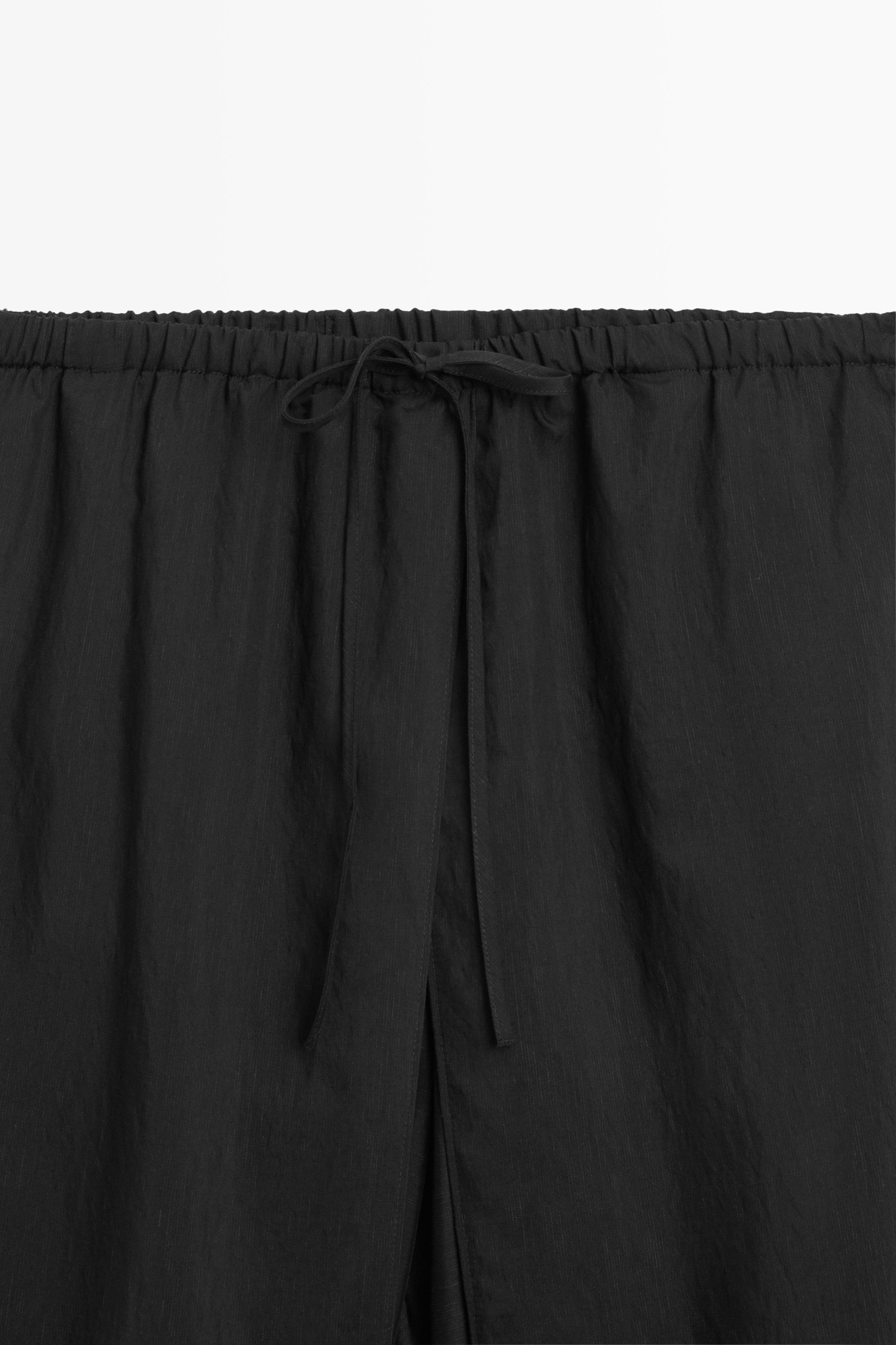 Double-layer pants with tie detail — BLACK