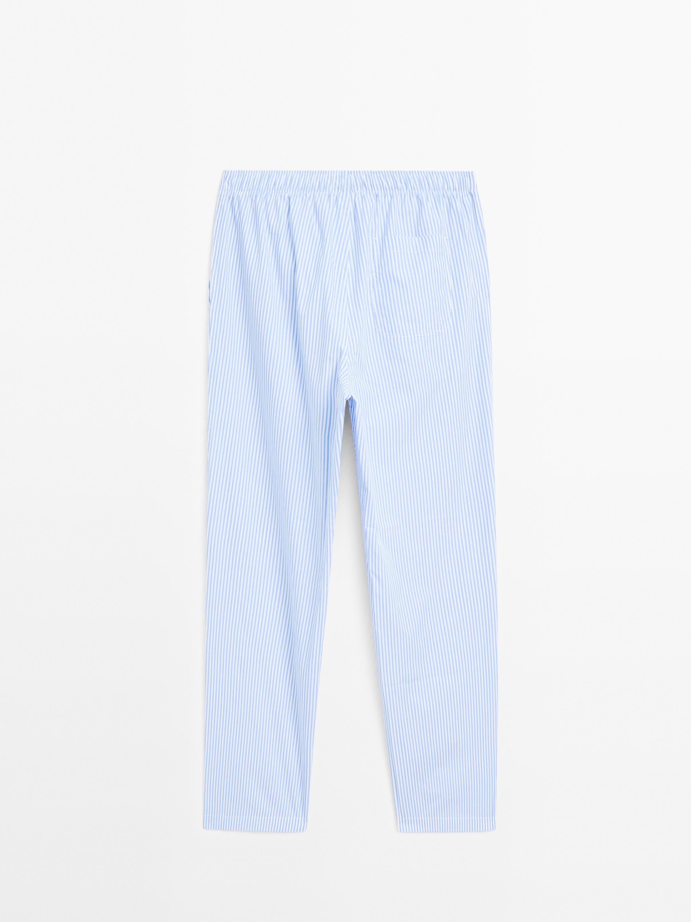 Short sleeve pyjama top and striped trousers