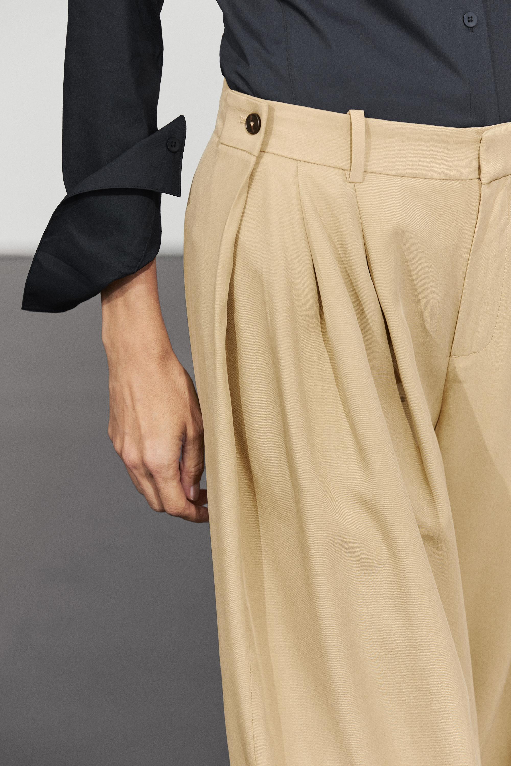 Flowing pleated pants with button detail — BEIGE