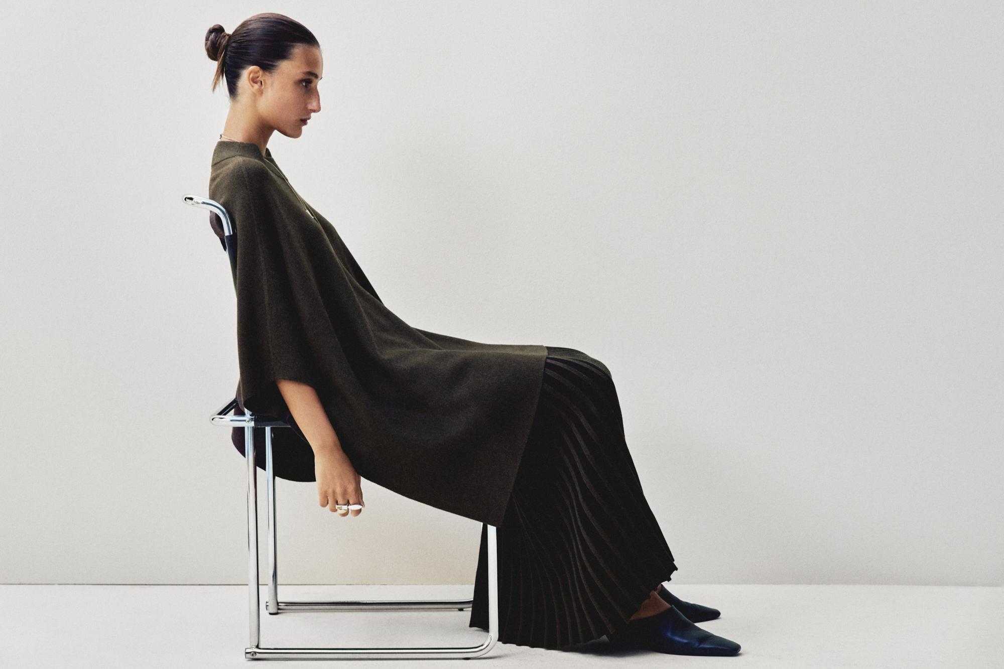 Knit cape with brooch detail