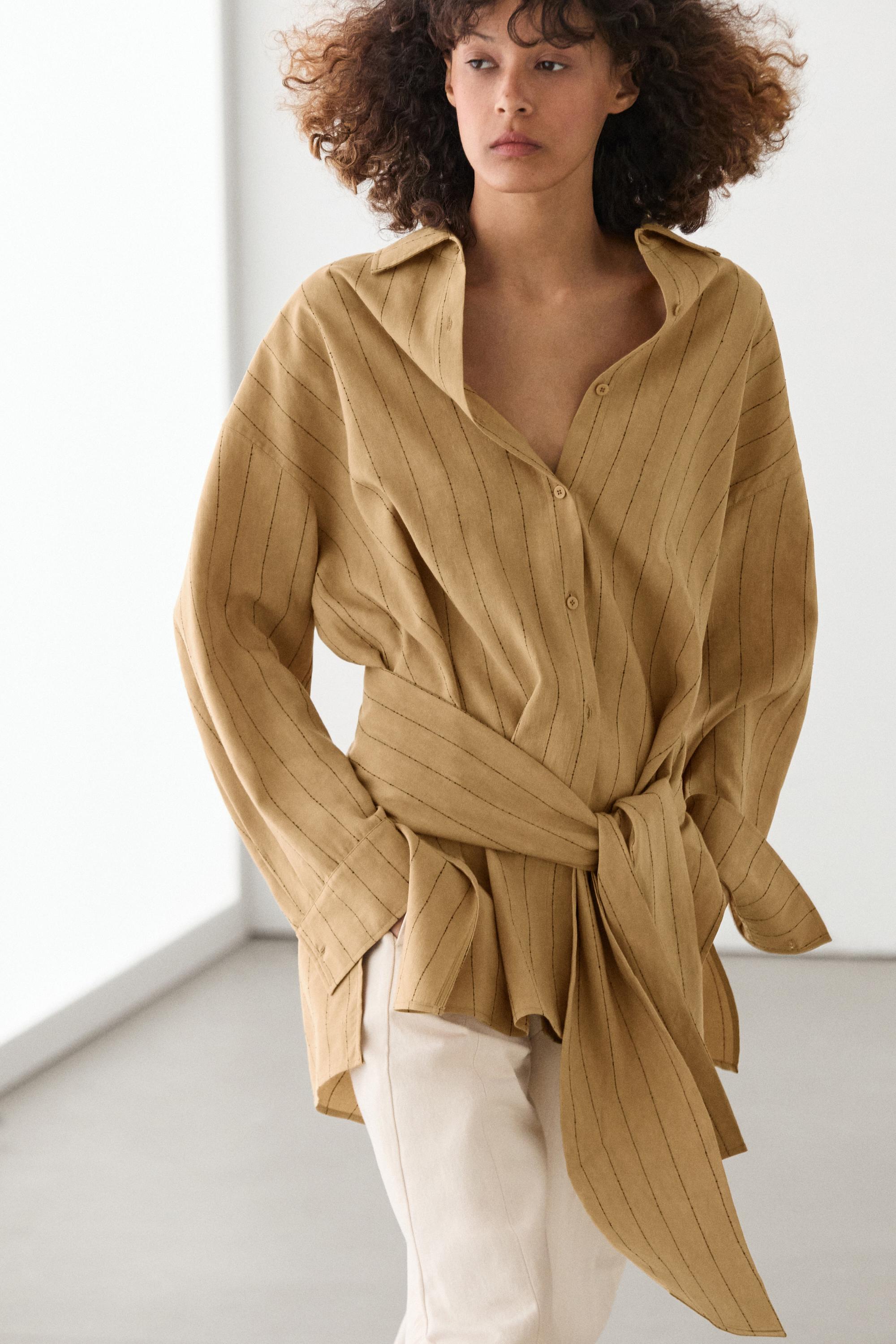 Striped flowing shirt with corset belt detail