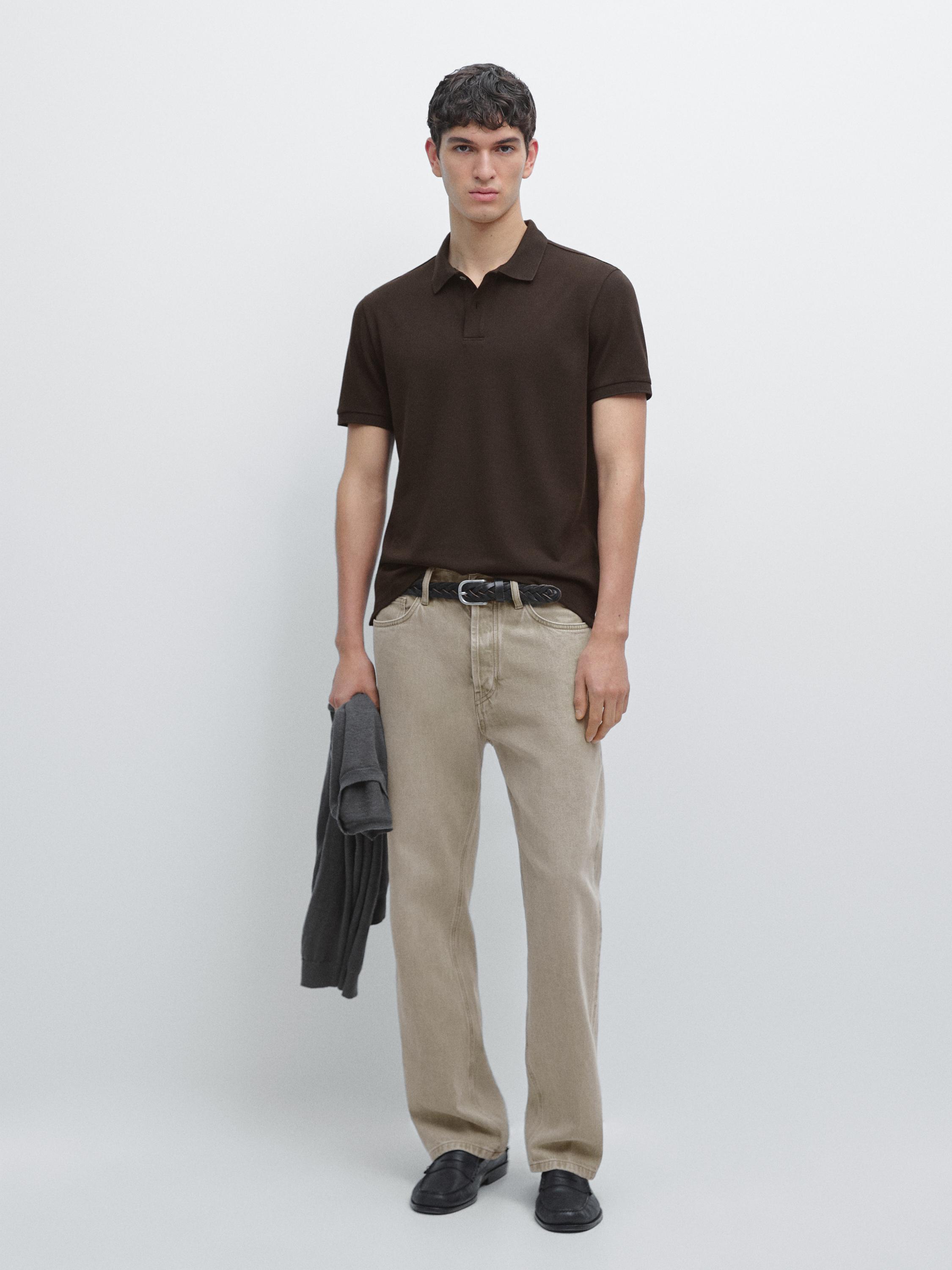 Chocolate short-sleeve polo set with beige pants.