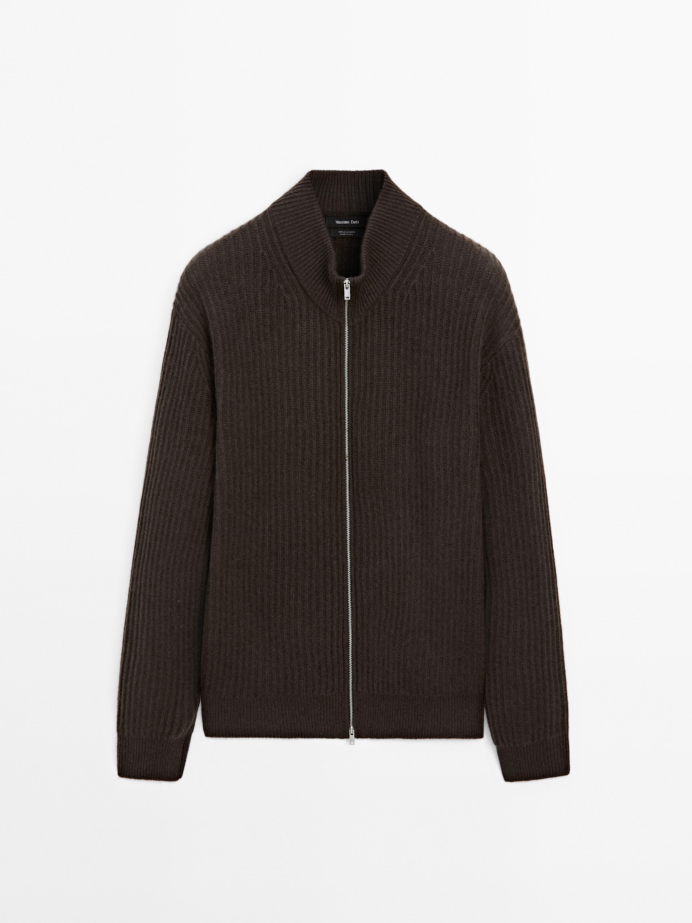 Front view of dark brown jacket with zipper and high collar.