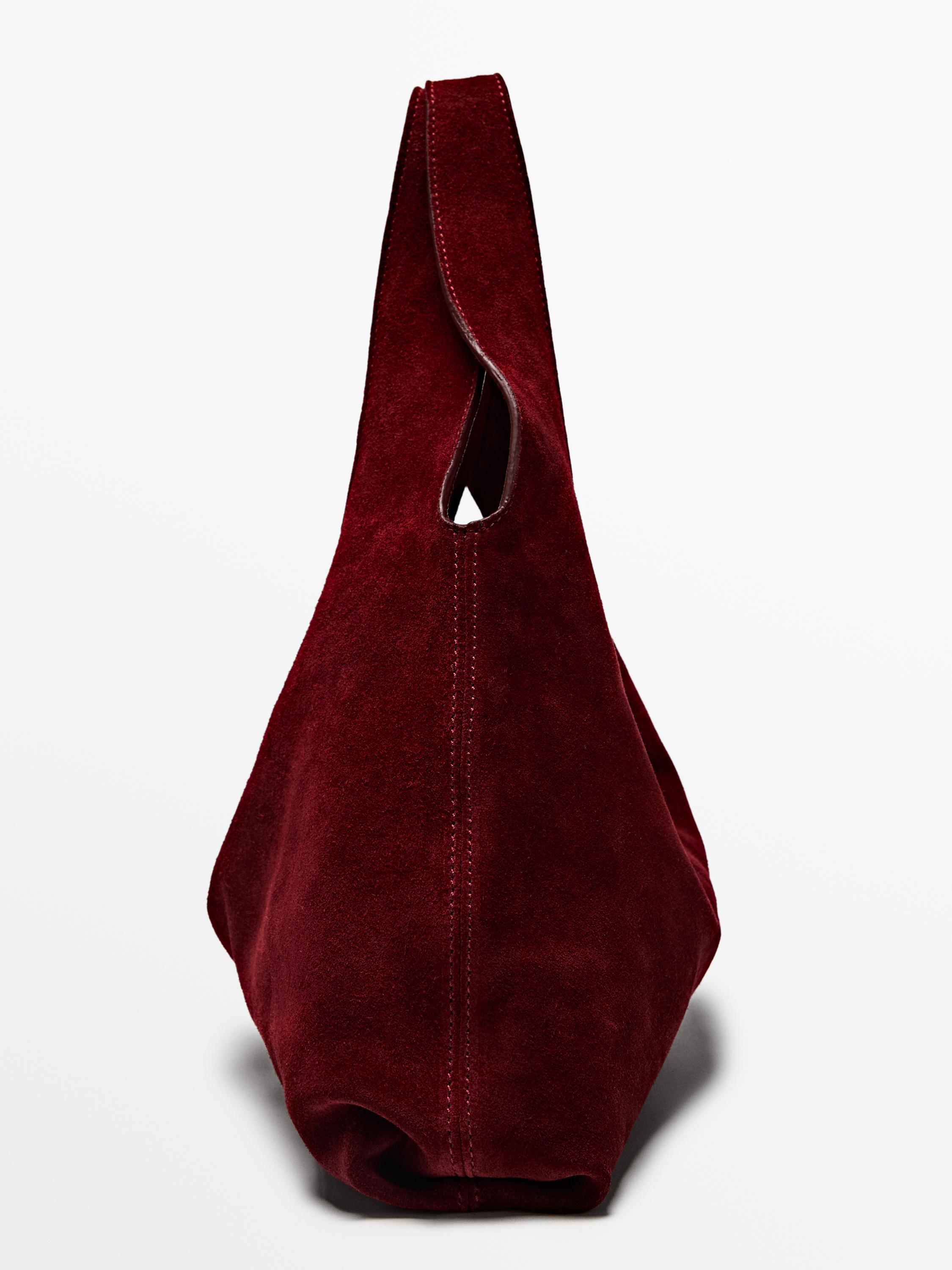 Çantë dore prej lëkure me copë kamoshi e mesme