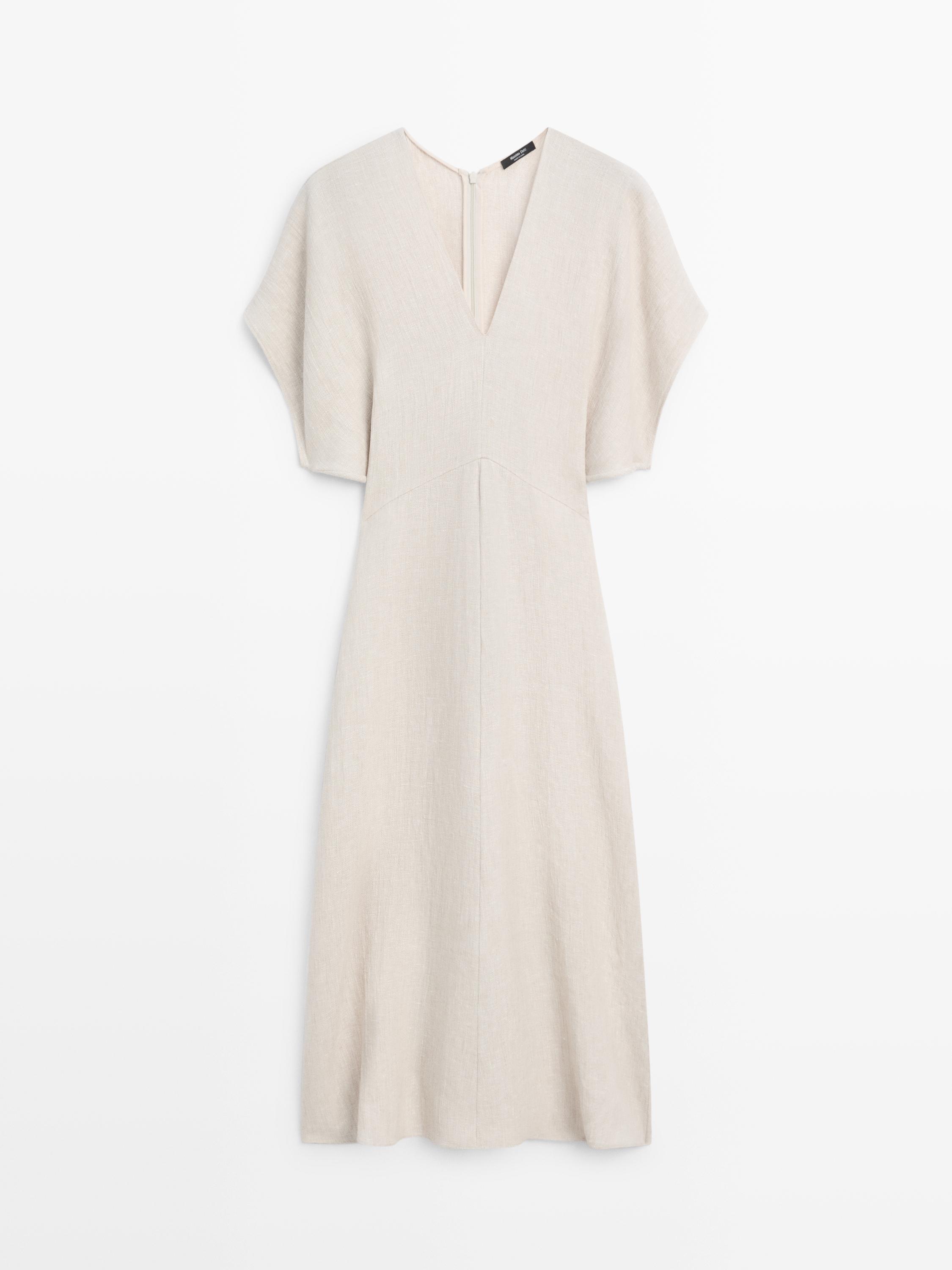 Front view of a raw dress with a V-neckline, wide short sleeves, and a straight cut to the knee.