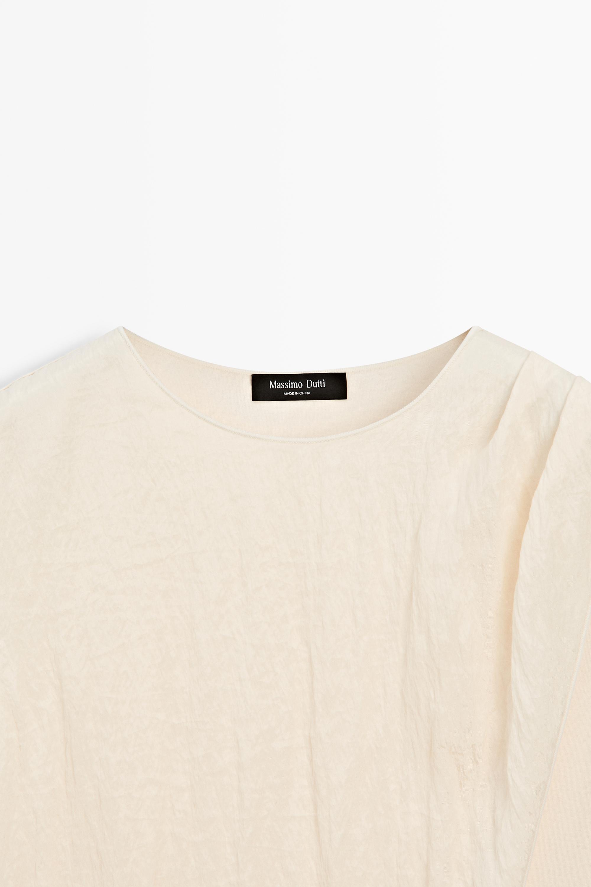 Crossover top with shoulder scarf detail — CREAM