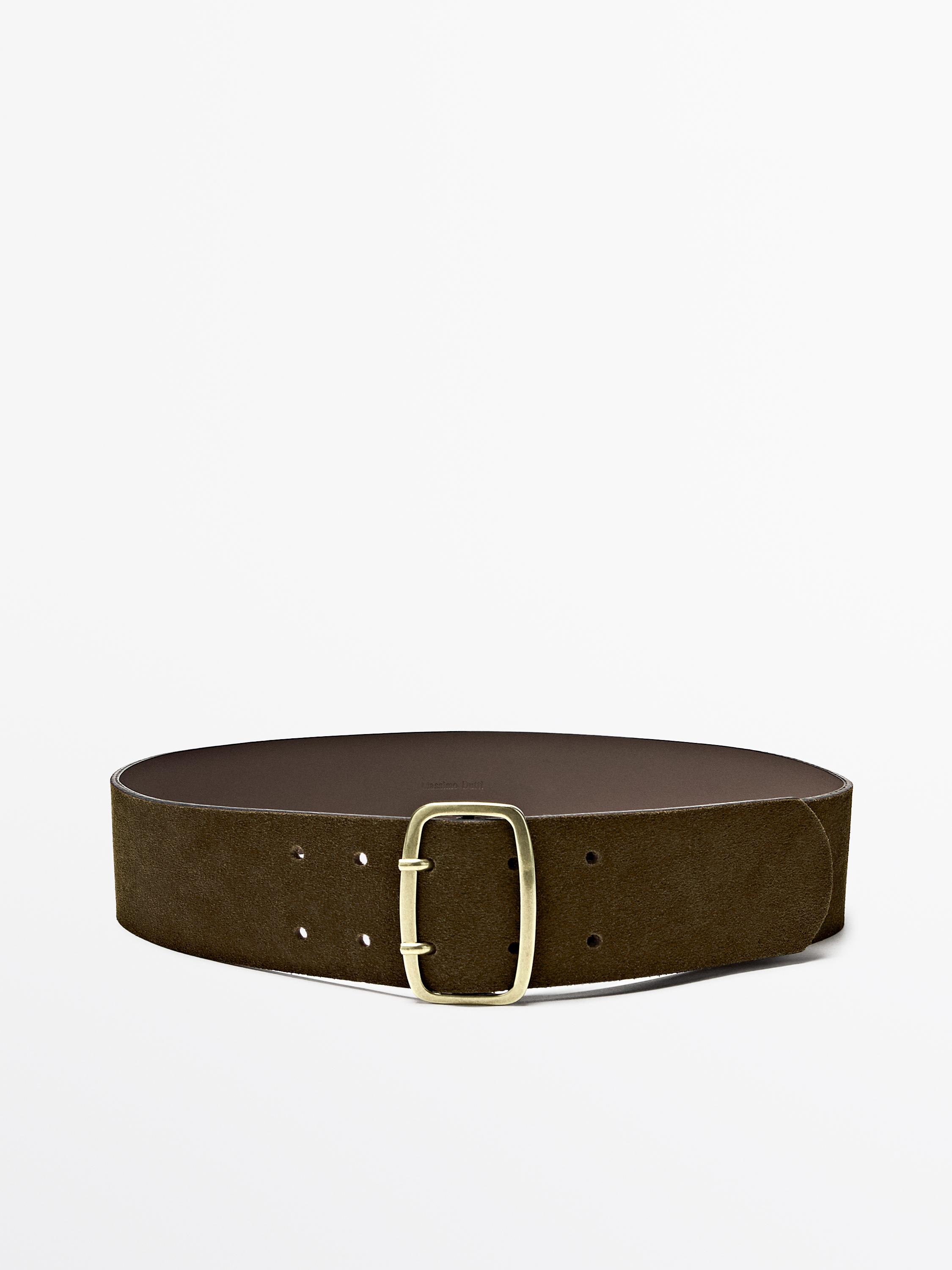 Hare-koloreko gerrikoaren aurreko bista, metalezko belarri angeluzuzenarekin eta doikuntzarako zulo anitzekin.