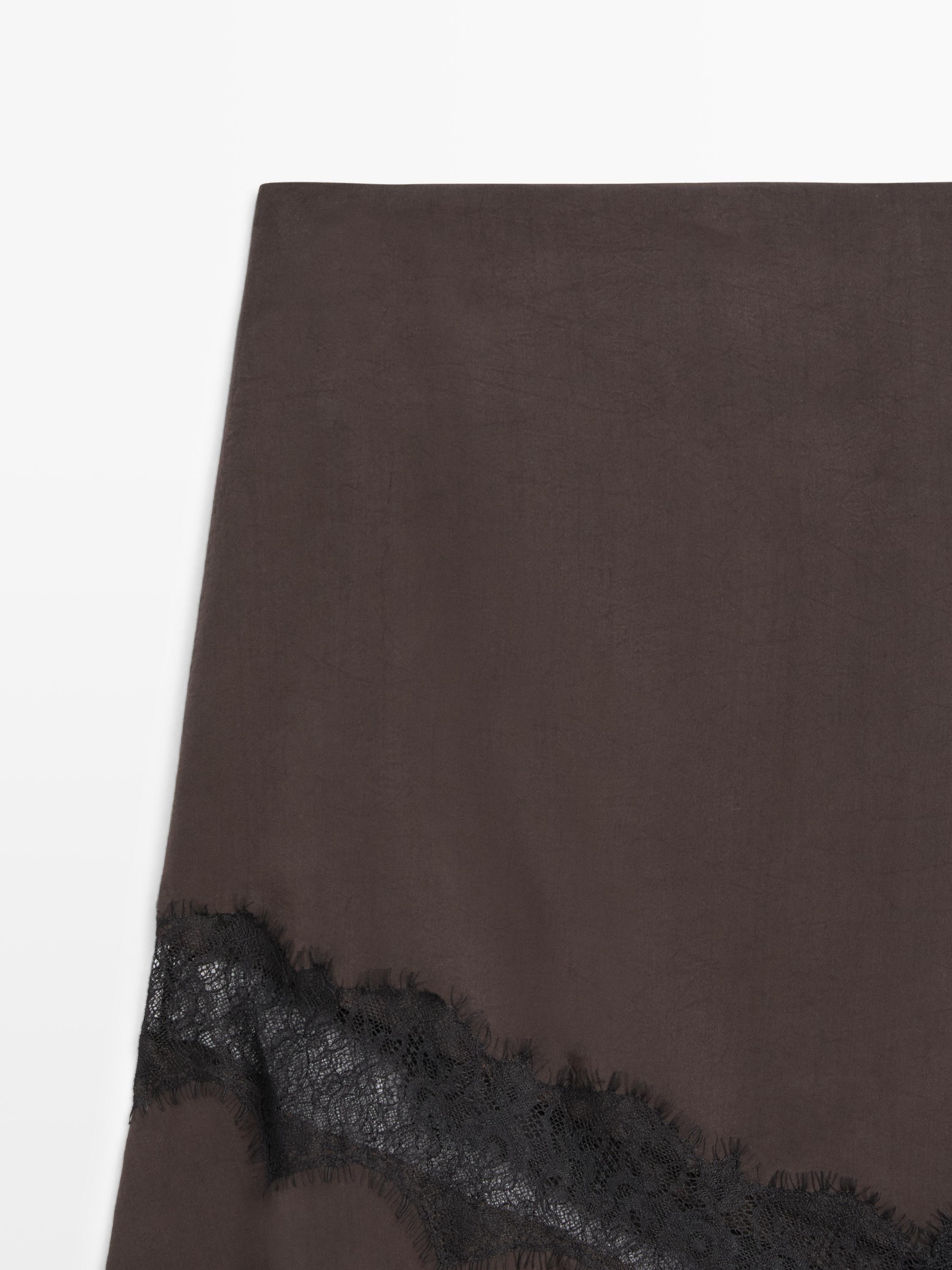 Flowing asymmetric midi skirt with lace detail