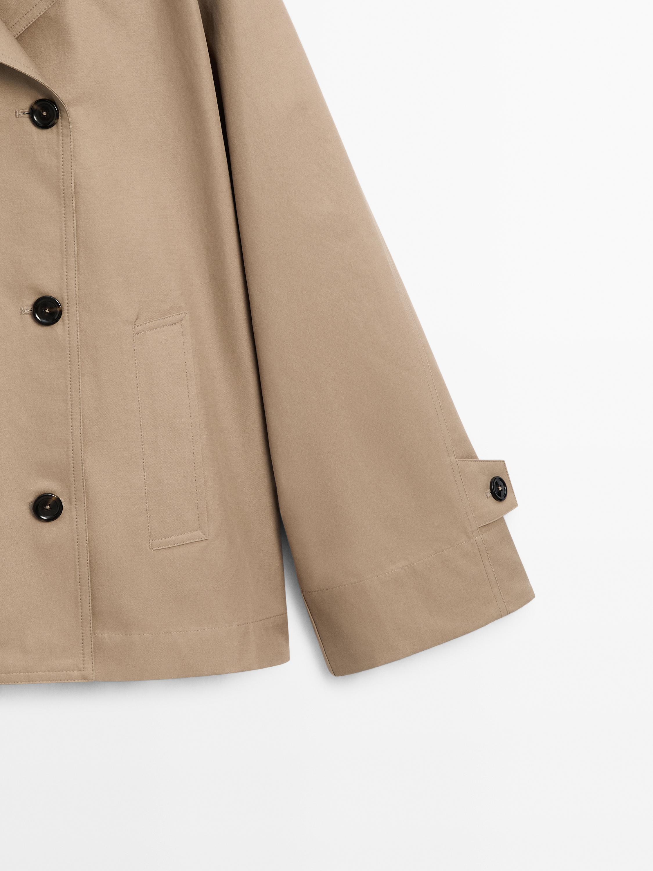 Short water-repellent cape trench coat
