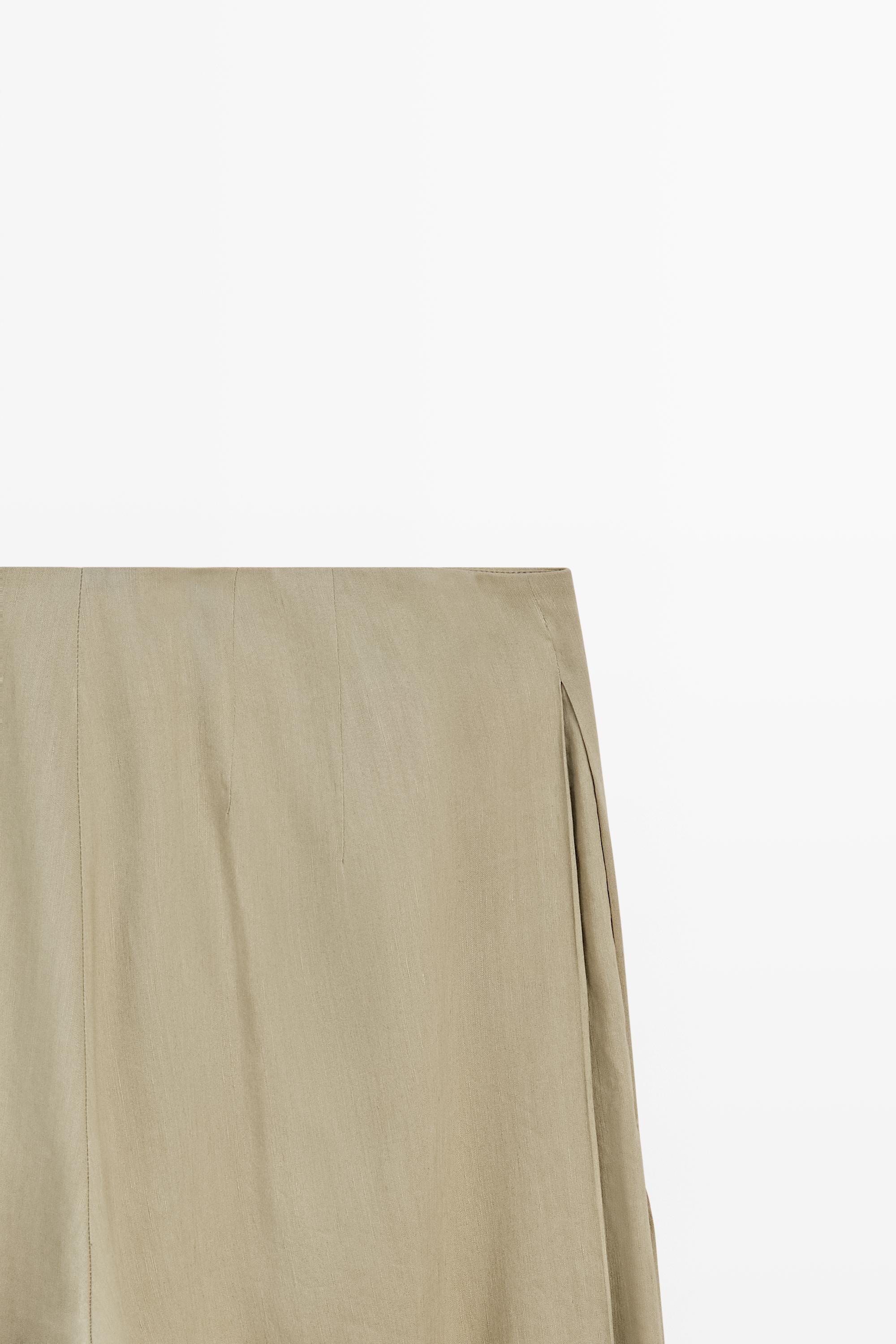 Flowing pleated pants - STUDIO — PALE KHAKI