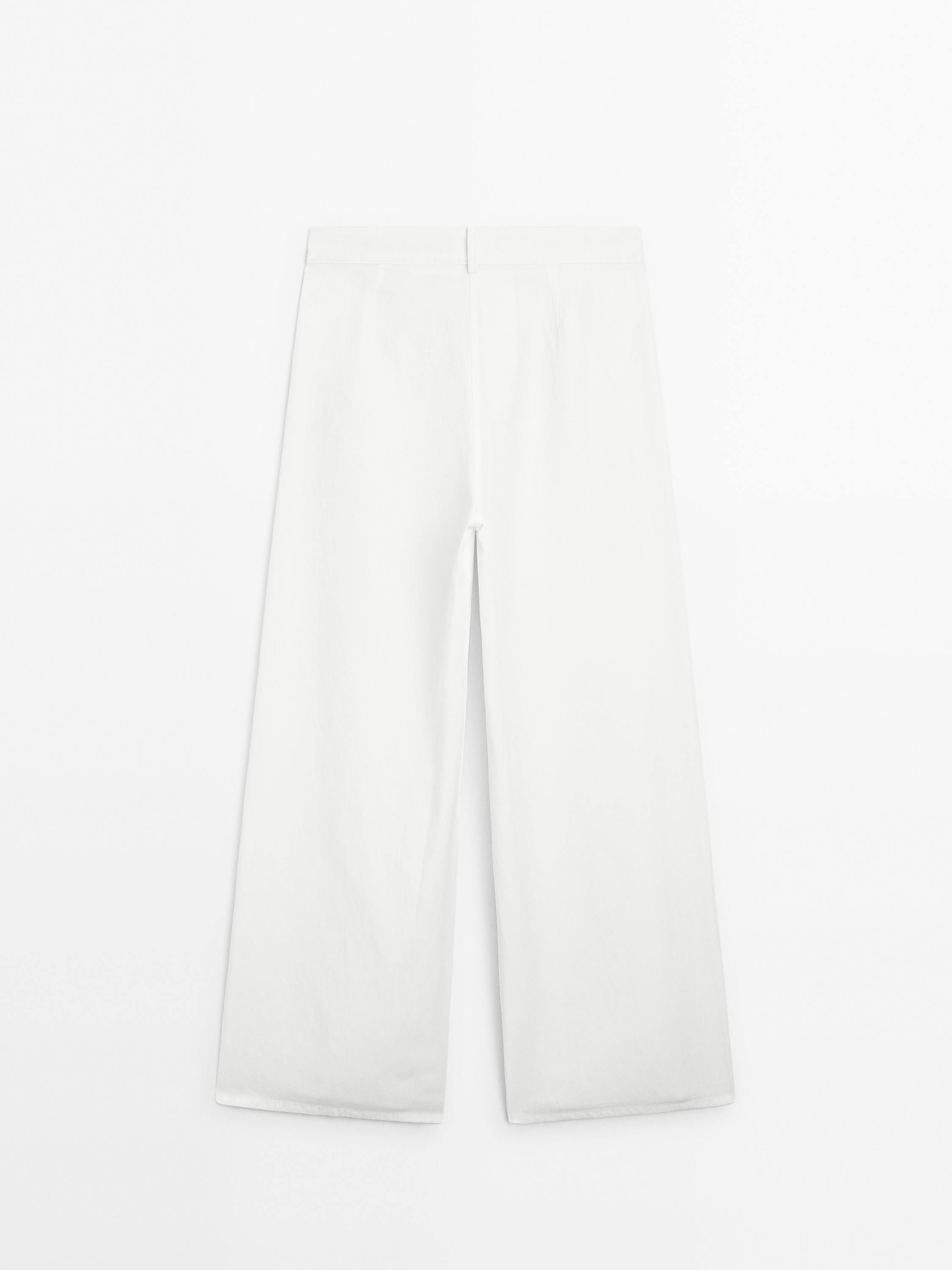 Flowing barrel fit trousers with seam detail