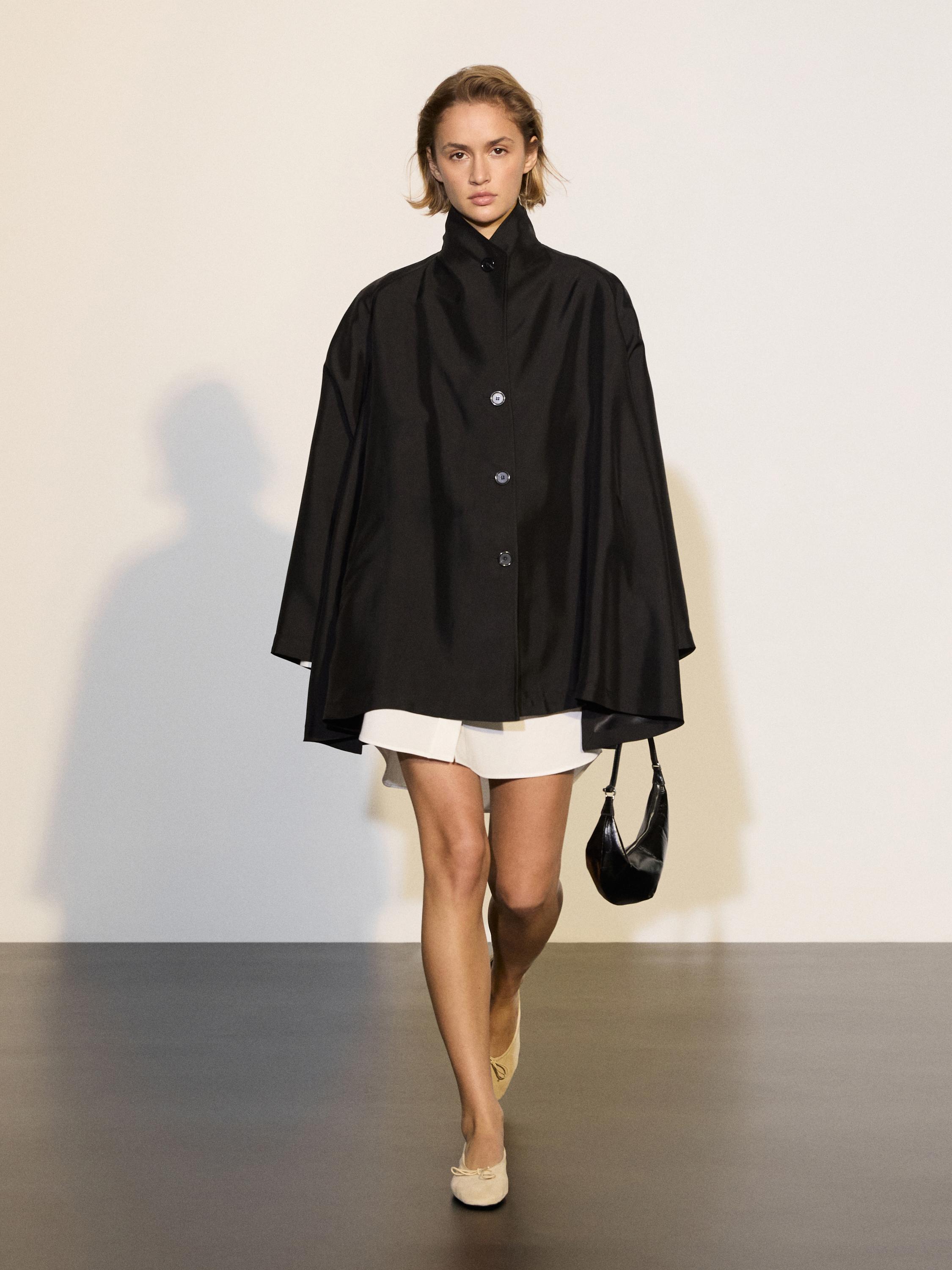 Flowing voluminous cape with button details — BLACK