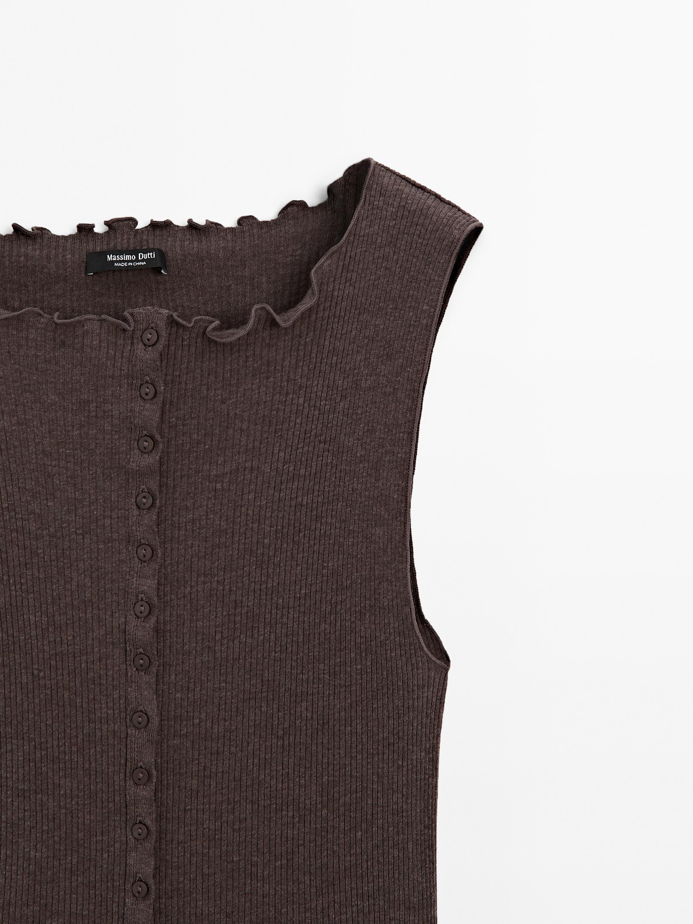 Knit waistcoat top with buttoned strap