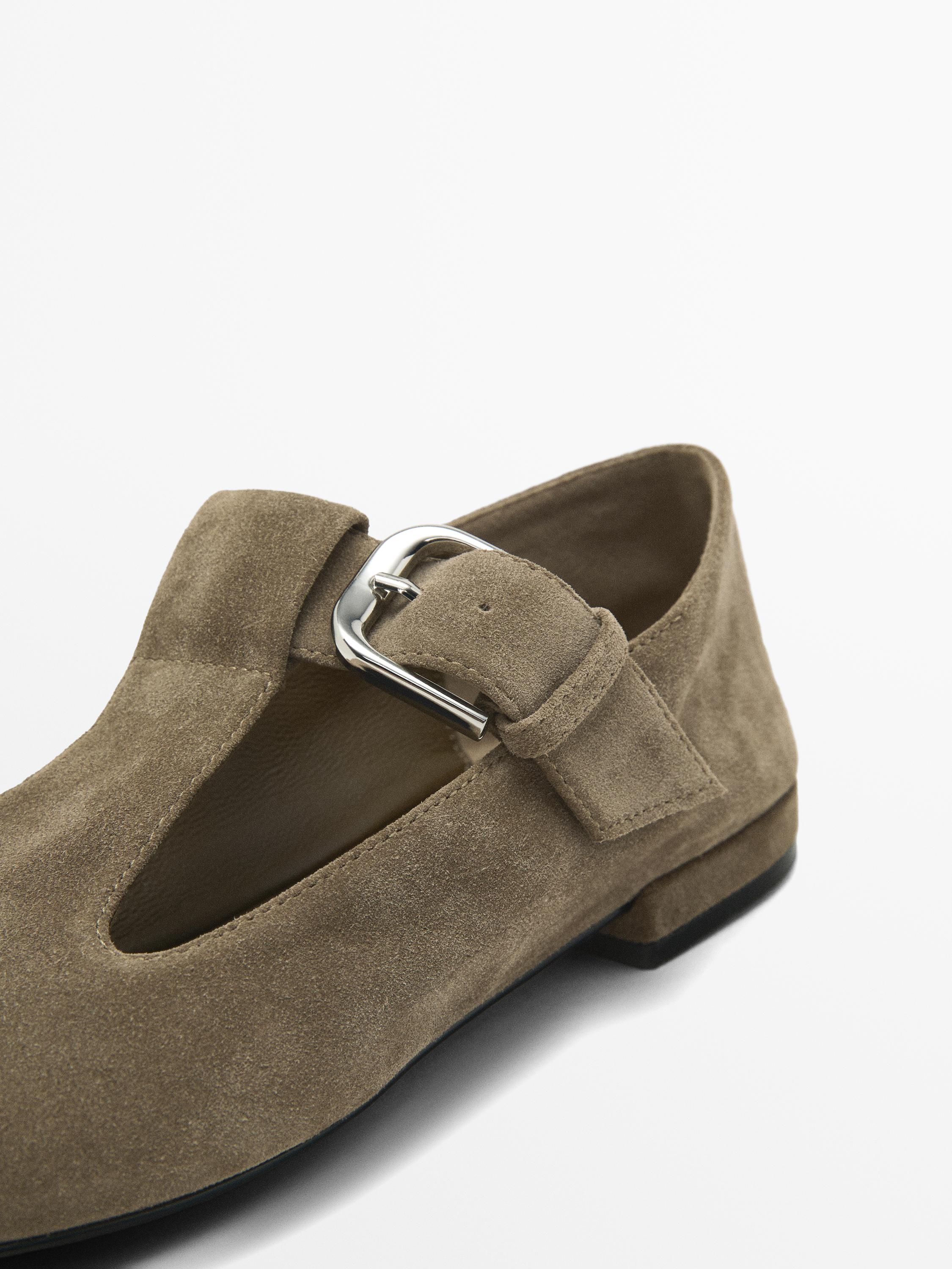 Flat shoes with buckled strap