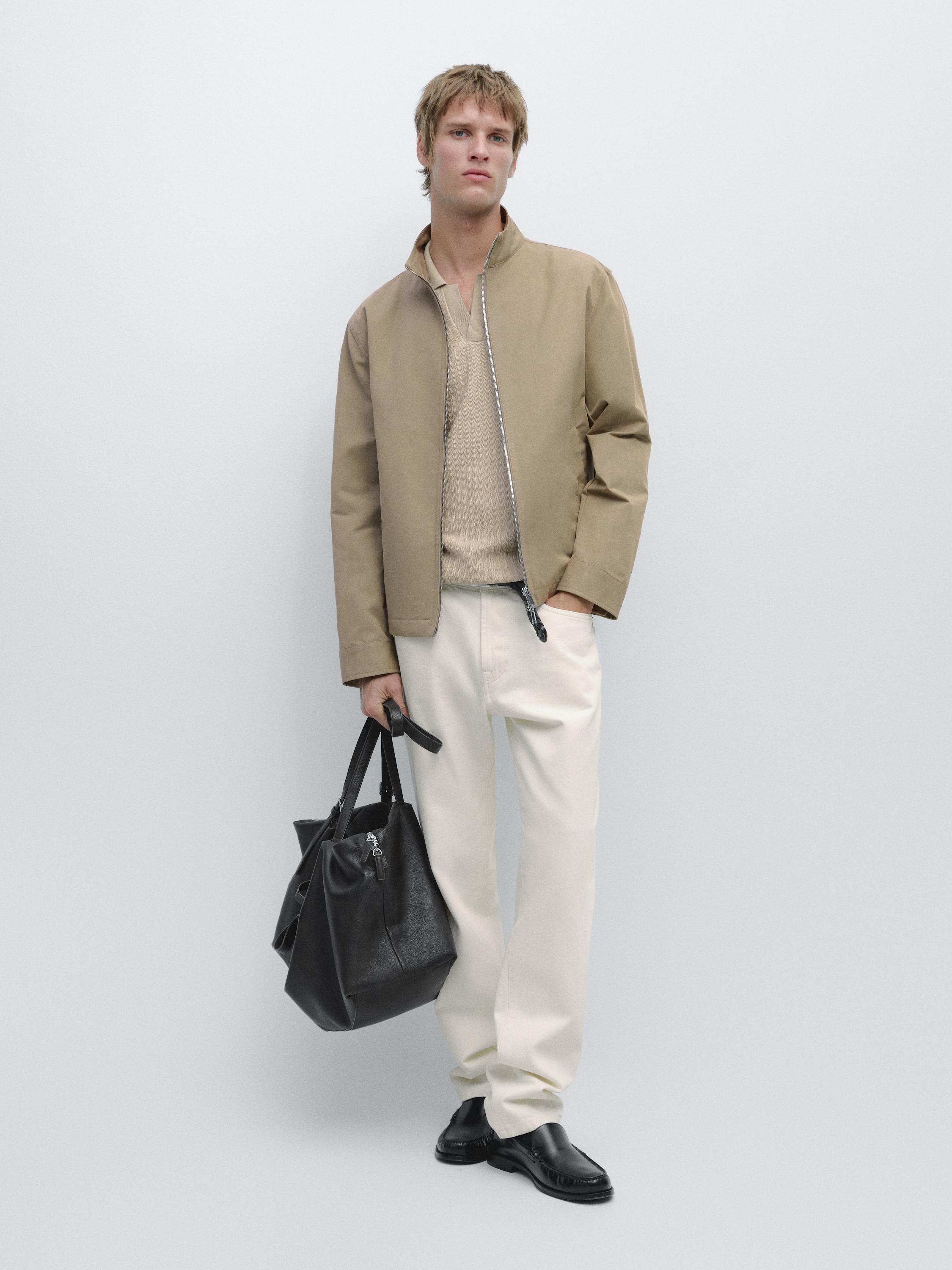 Toasted jacket set with zipper, white pants, and black shoes.