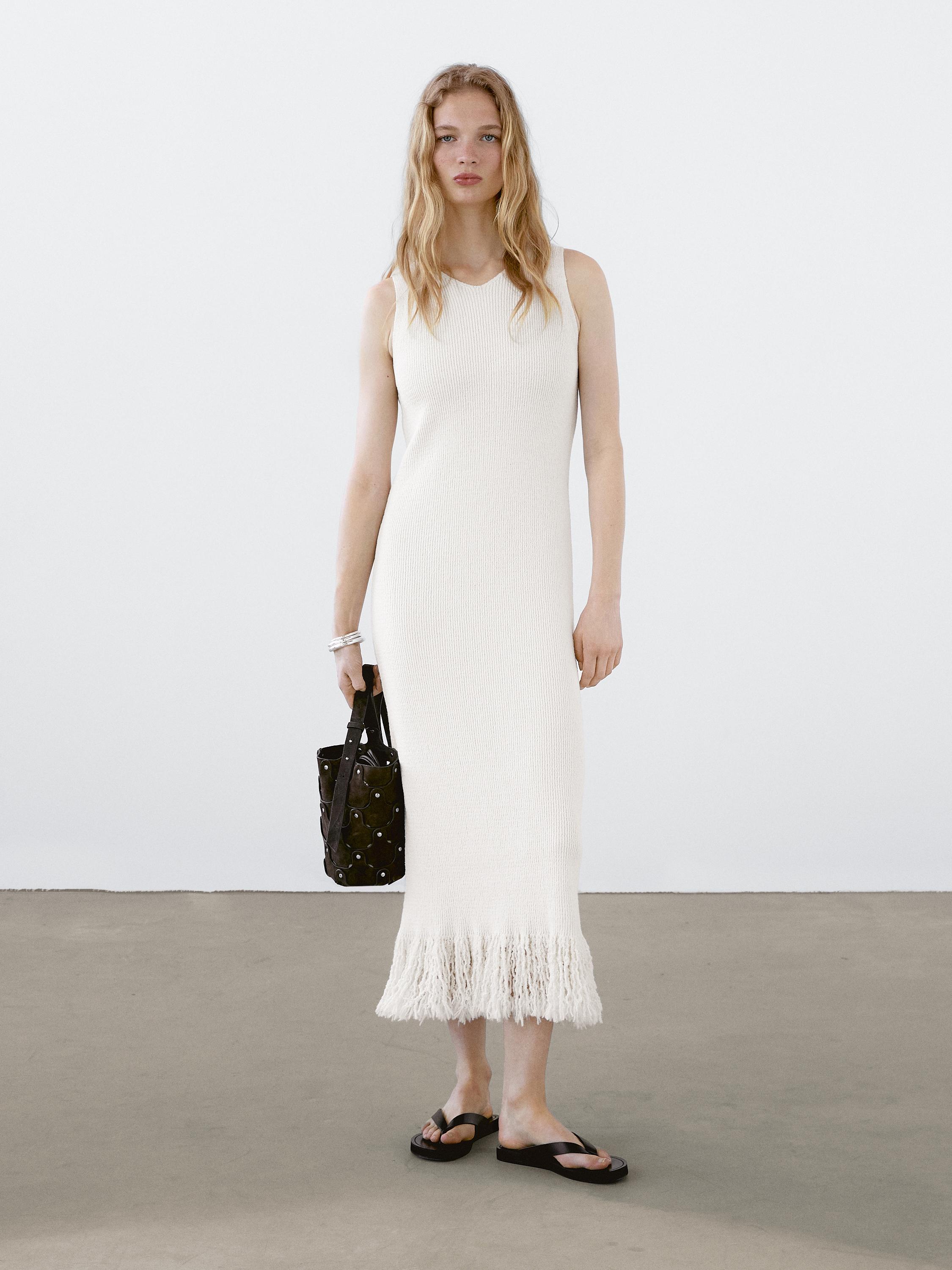 Knit dress with fringed hem